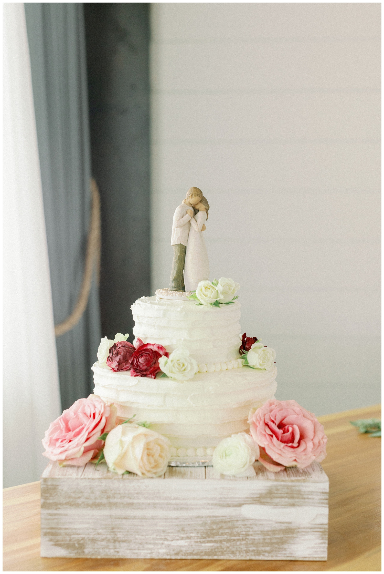 two tiered white wedding cake