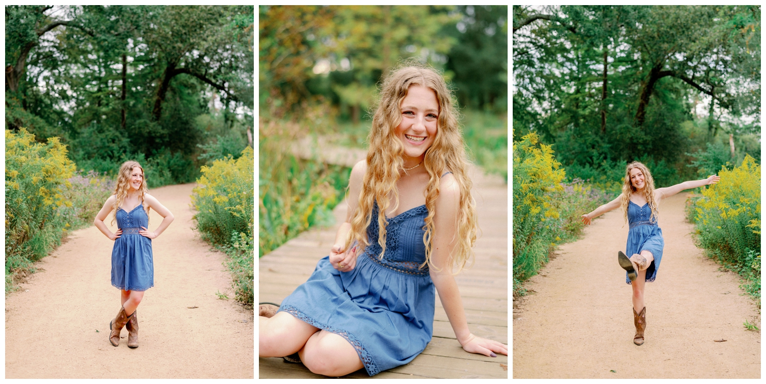 Houston Senior Photography Team at Arboretum with girl in denim dress in brown boots sitting on pathway in front of field
