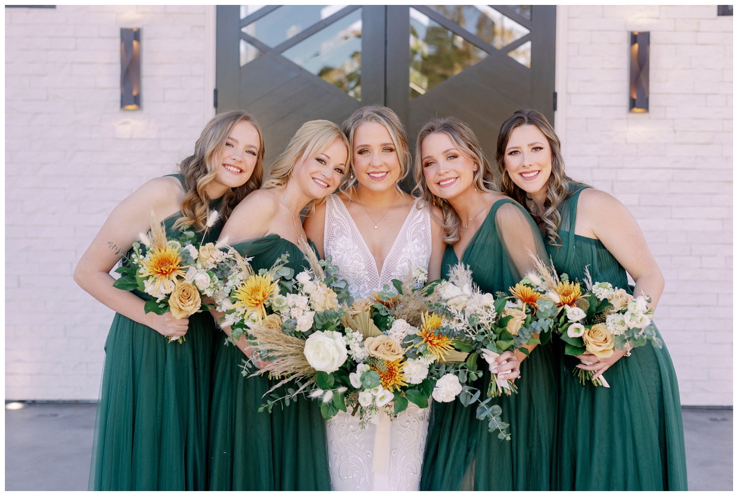 bride with bridesmaids in emerald green dresses Jennings Trace Wedding