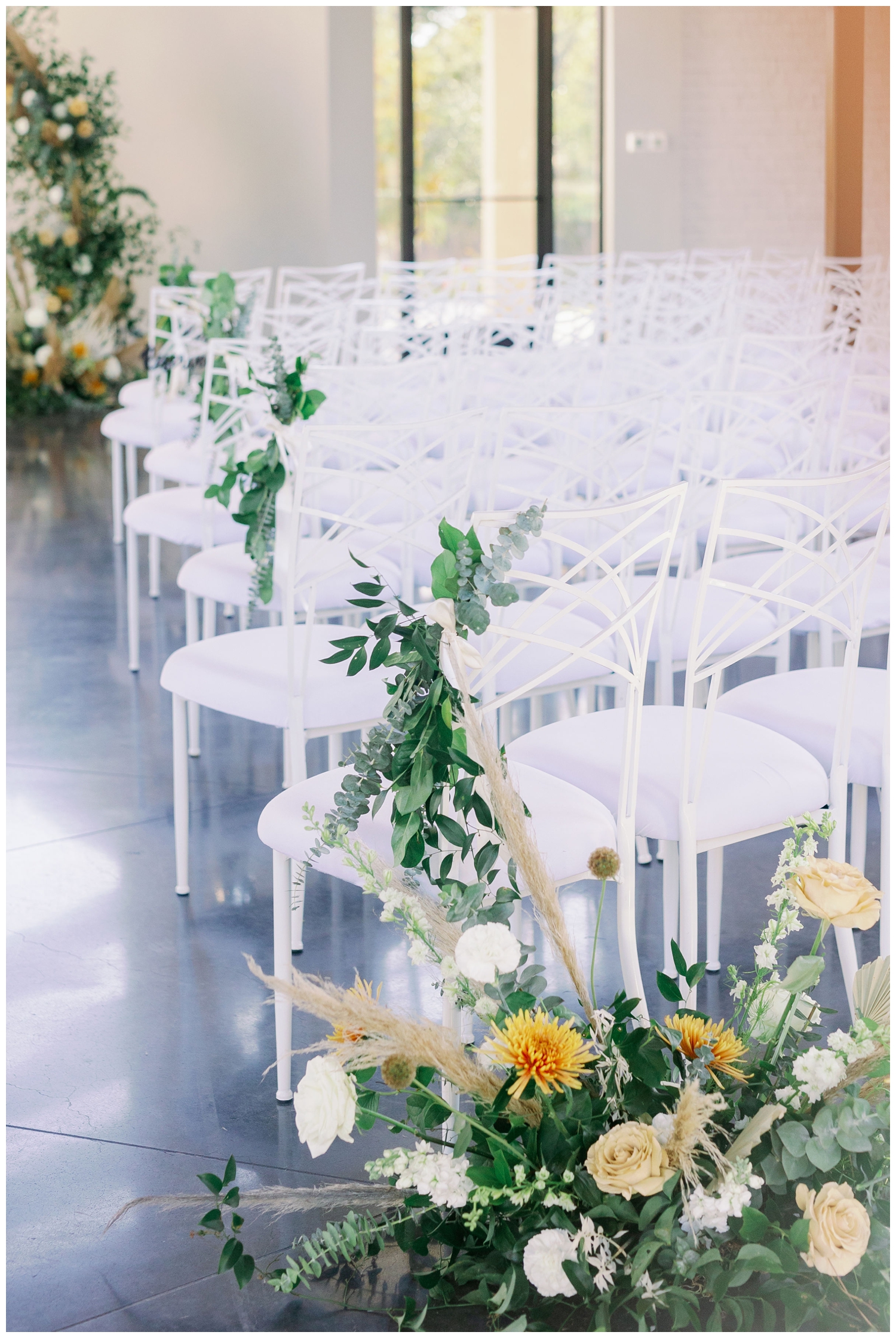 white chairs with boho florals inside the chapel at Jennings Trace in Montgomery, Texas