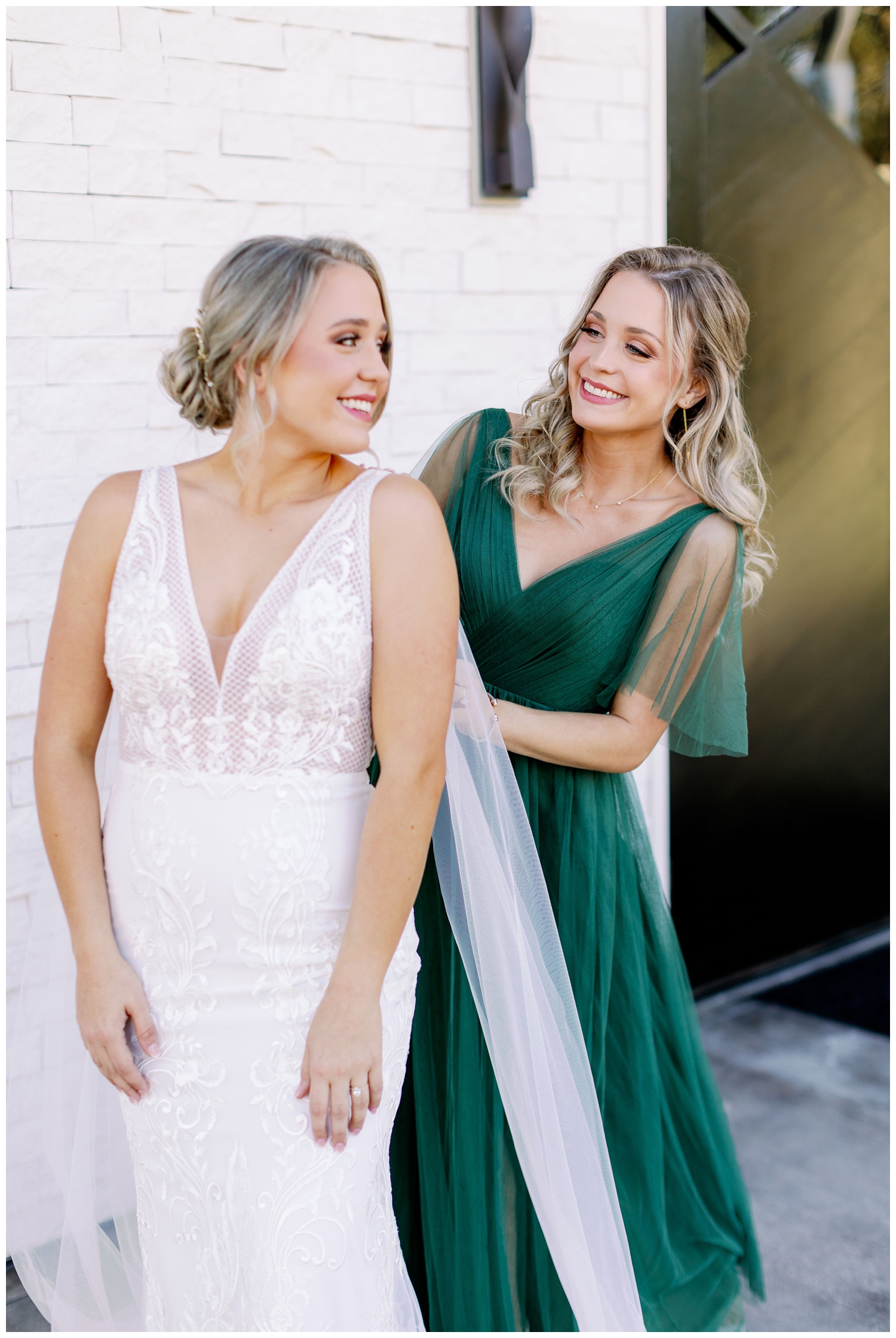 bride and sister buttoning dress