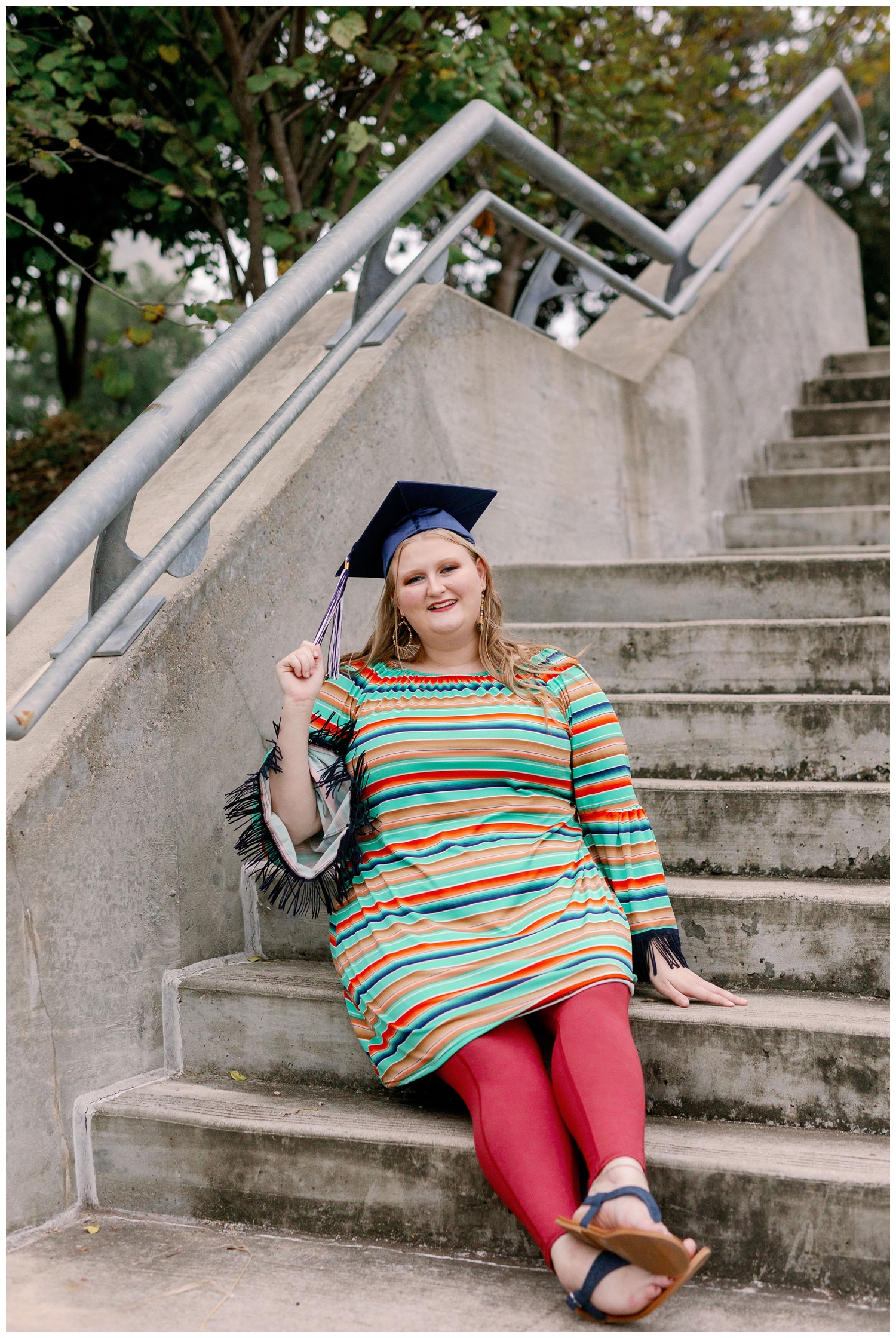 girl in striped colorful shirt sitting on staircase at Eleanor Tinsley park