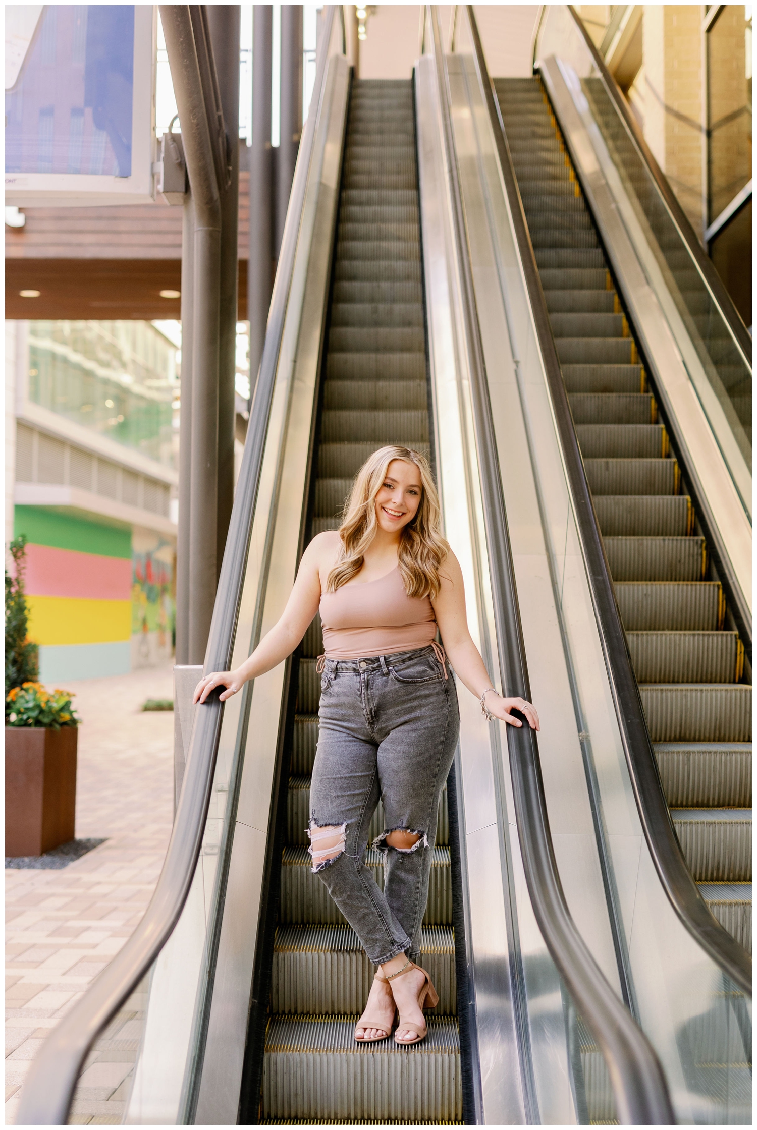 high school senior girl on escalator