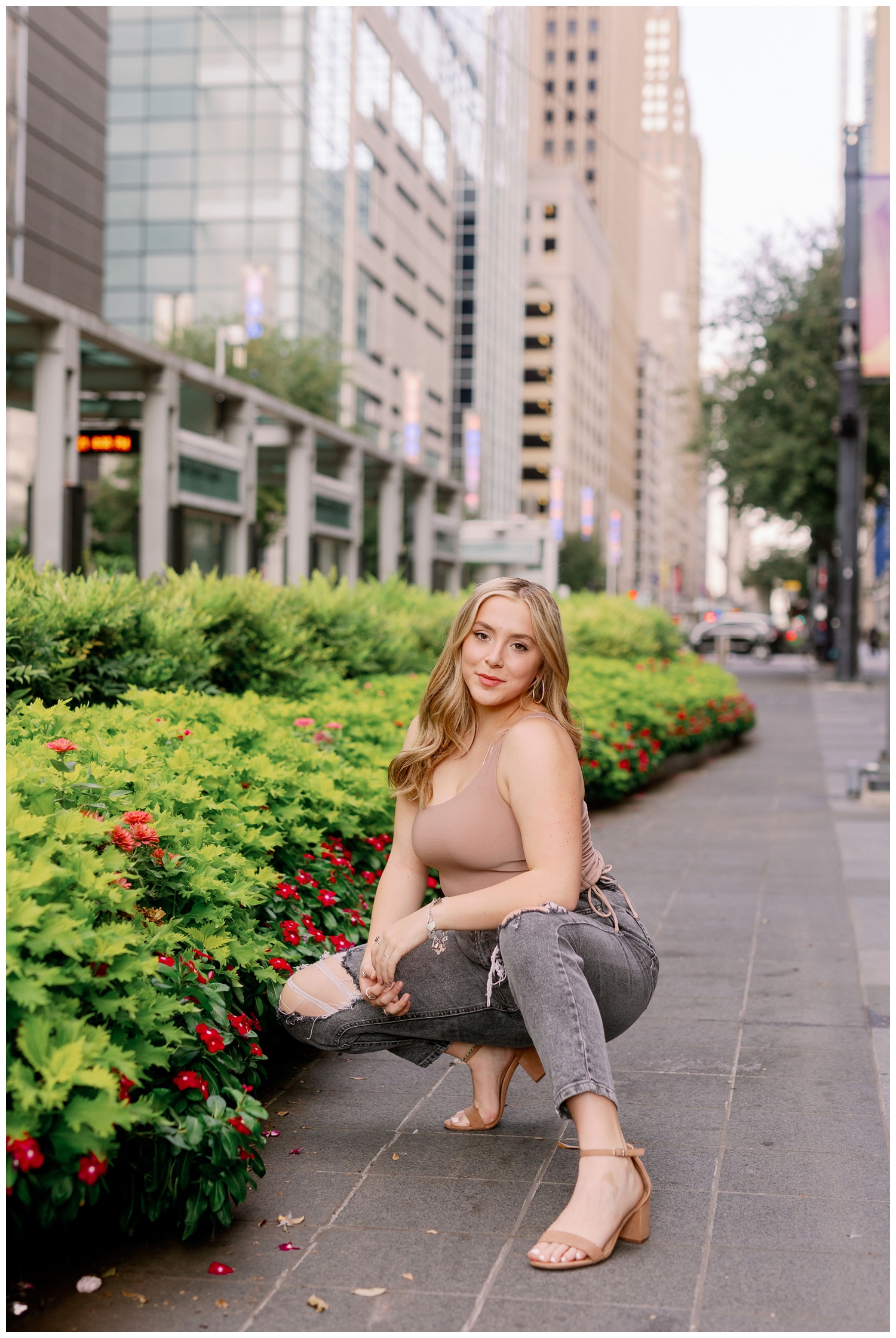 girl squatting on city streets in Houston