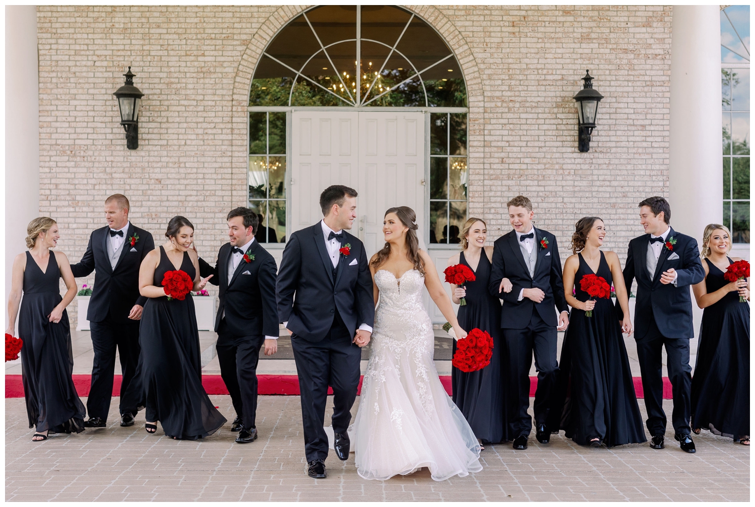 bride and groom holding hands and walking with bridal party Sugar Creek Country Club wedding