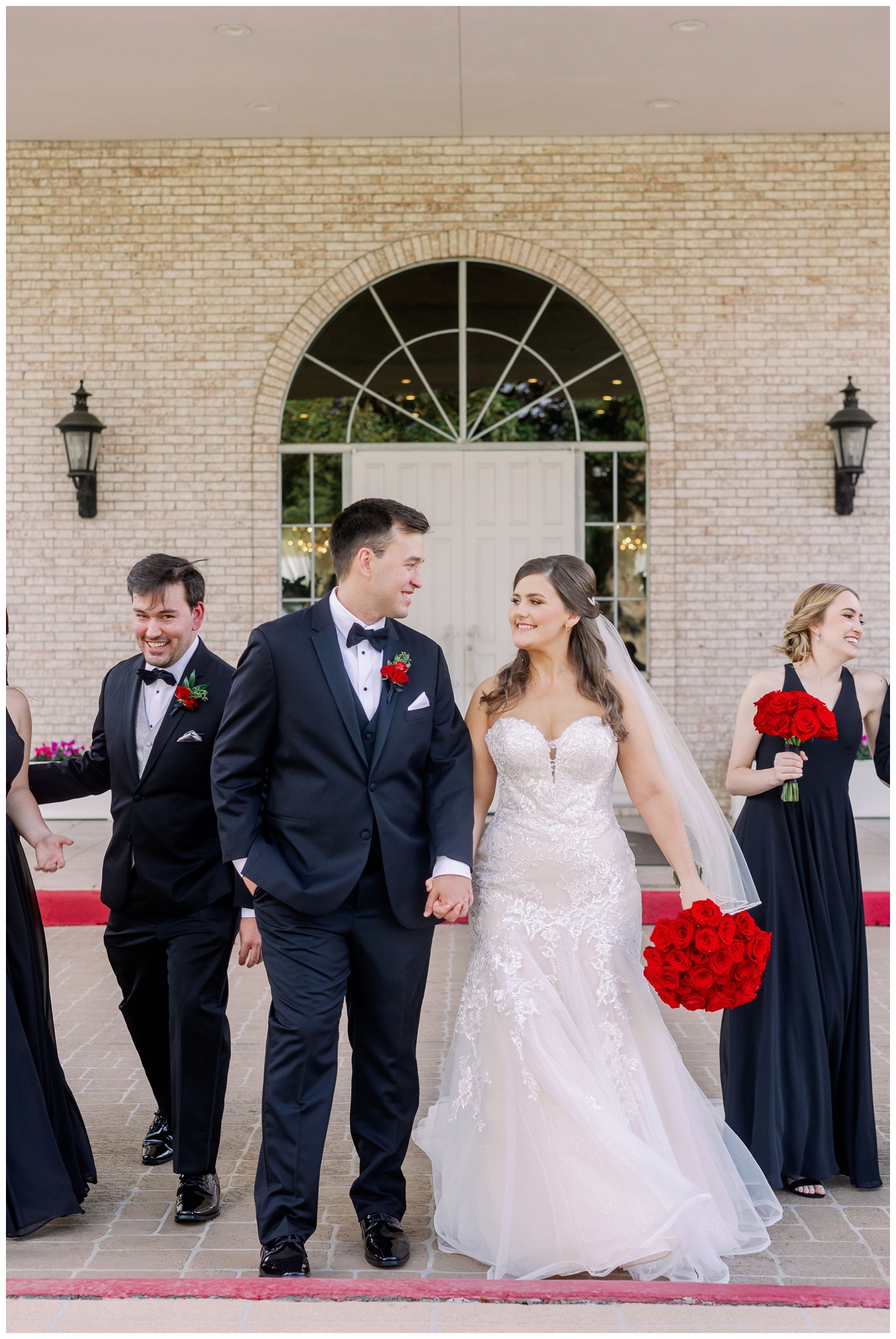 bride and groom smiling and walking holding hands in Sugar Land, Texas at Sugar Creek Country Club wedding venue