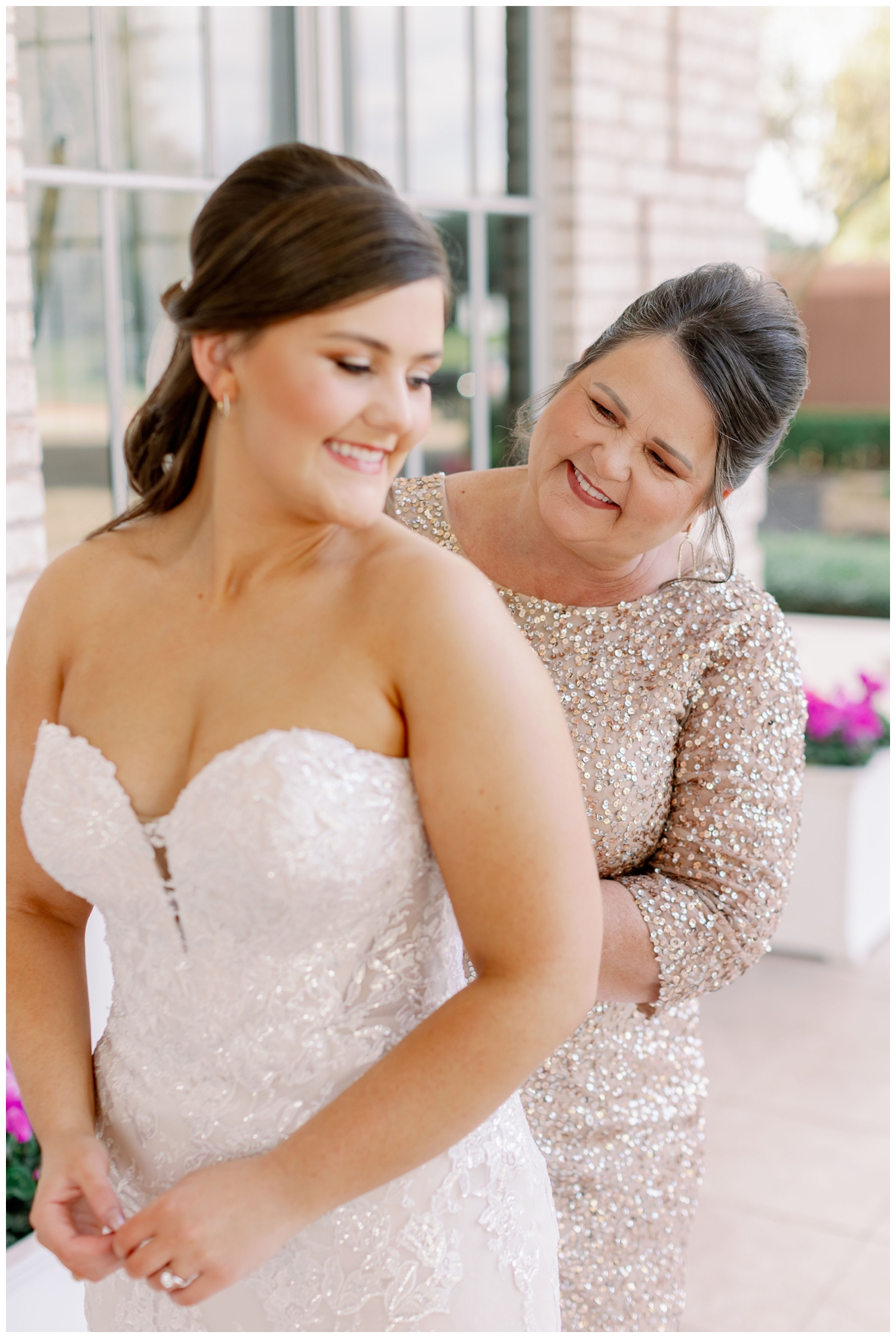 bride and mother fastening gown for Sugar Creek Country Club wedding