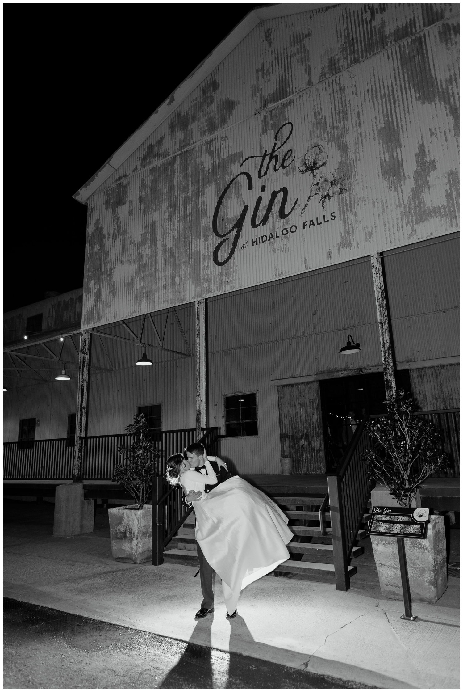 night time portrait bride and groom dipping in front of Gin Hidalgo Falls wedding venue