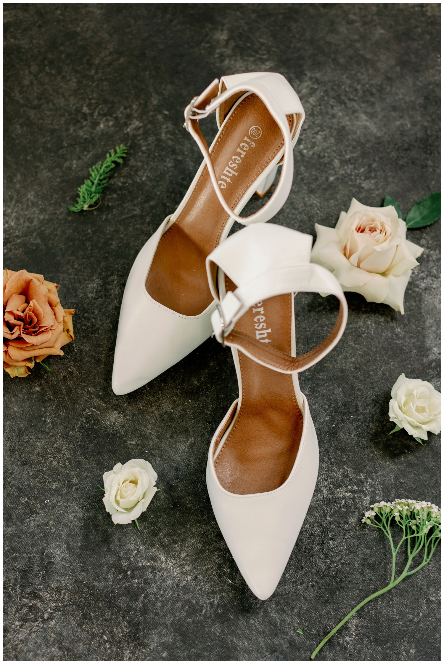 cream wedding heels surrounded by florals for college station wedding photography flat lay