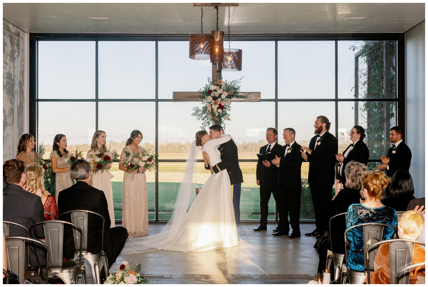College Station wedding photography bride and groom kissing during ceremony