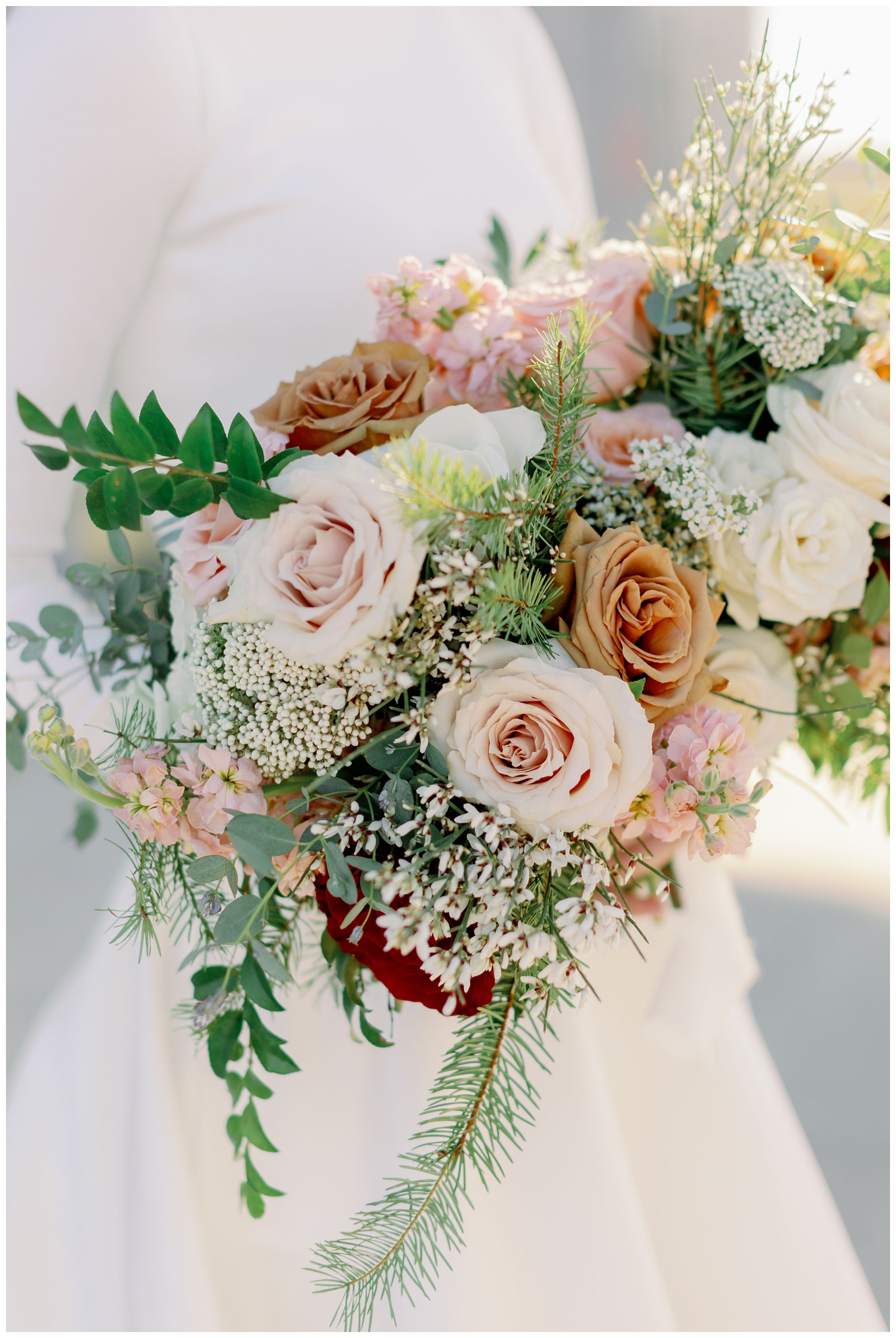 closeup of peach and cream floral wedding bouquet for College Station wedding photography