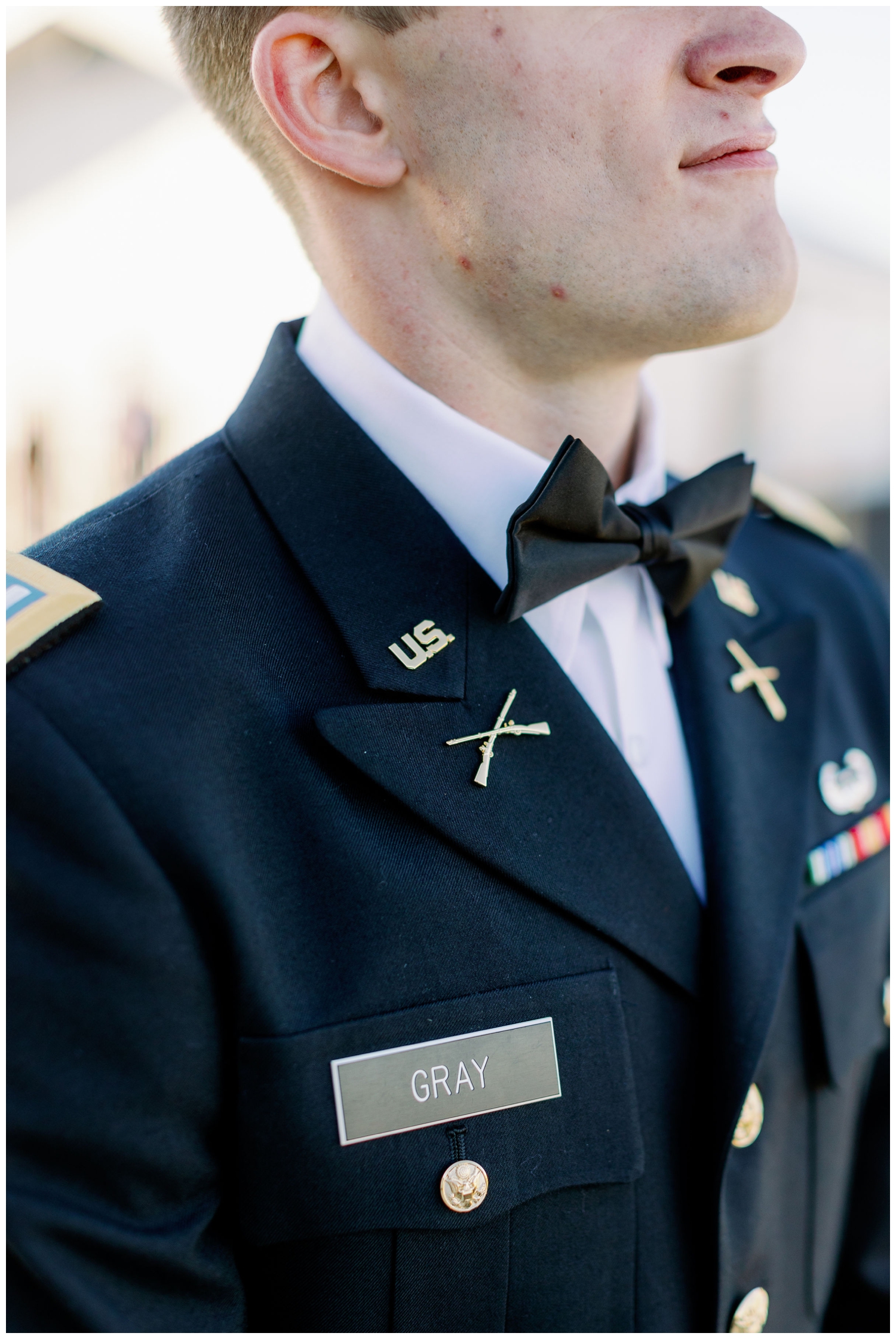 close up of groom in military uniform