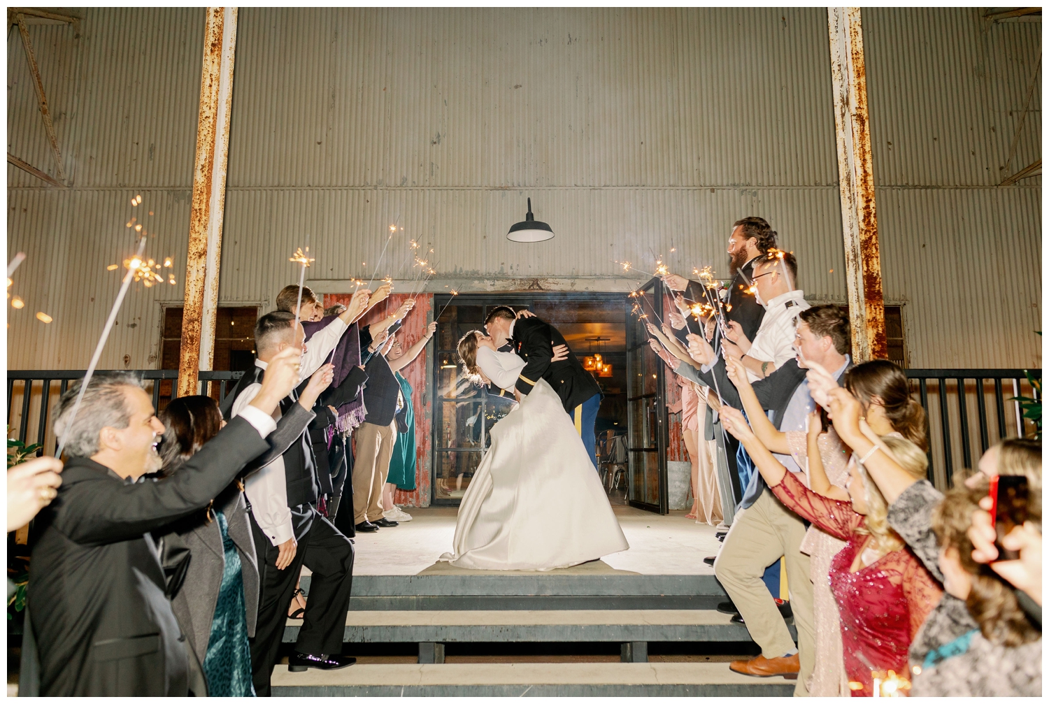 bride and groom kissing during sparkler exit at The Gin at Hidalgo Falls wedding venue