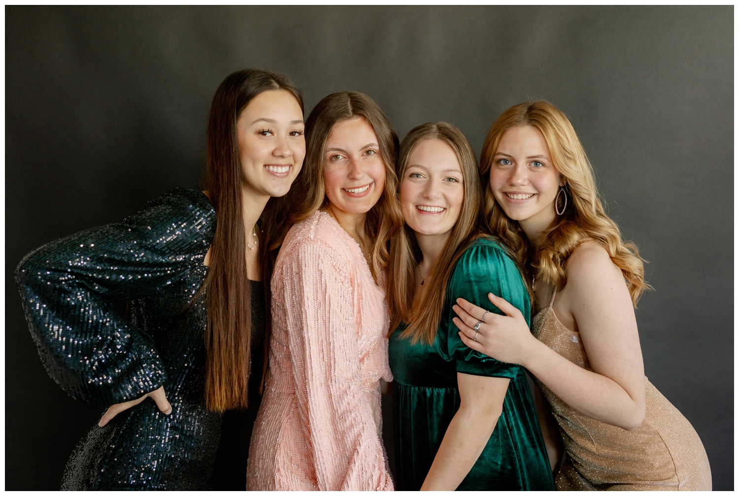 four high school senior girls posing for Reed Gallagher Photography model team