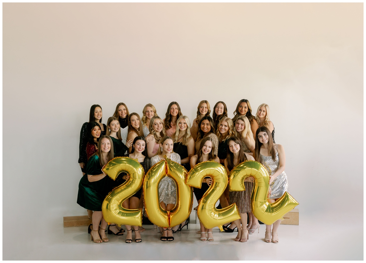 Reed Gallagher Photography model team posing with 2022 balloons for New Years senior pictures