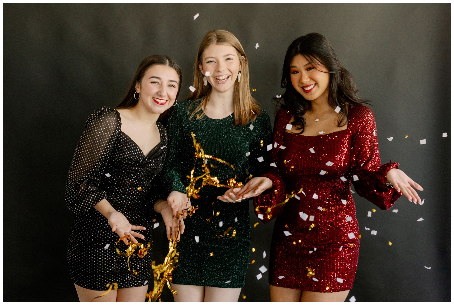 confetti shot with three girls in sparkly dresses