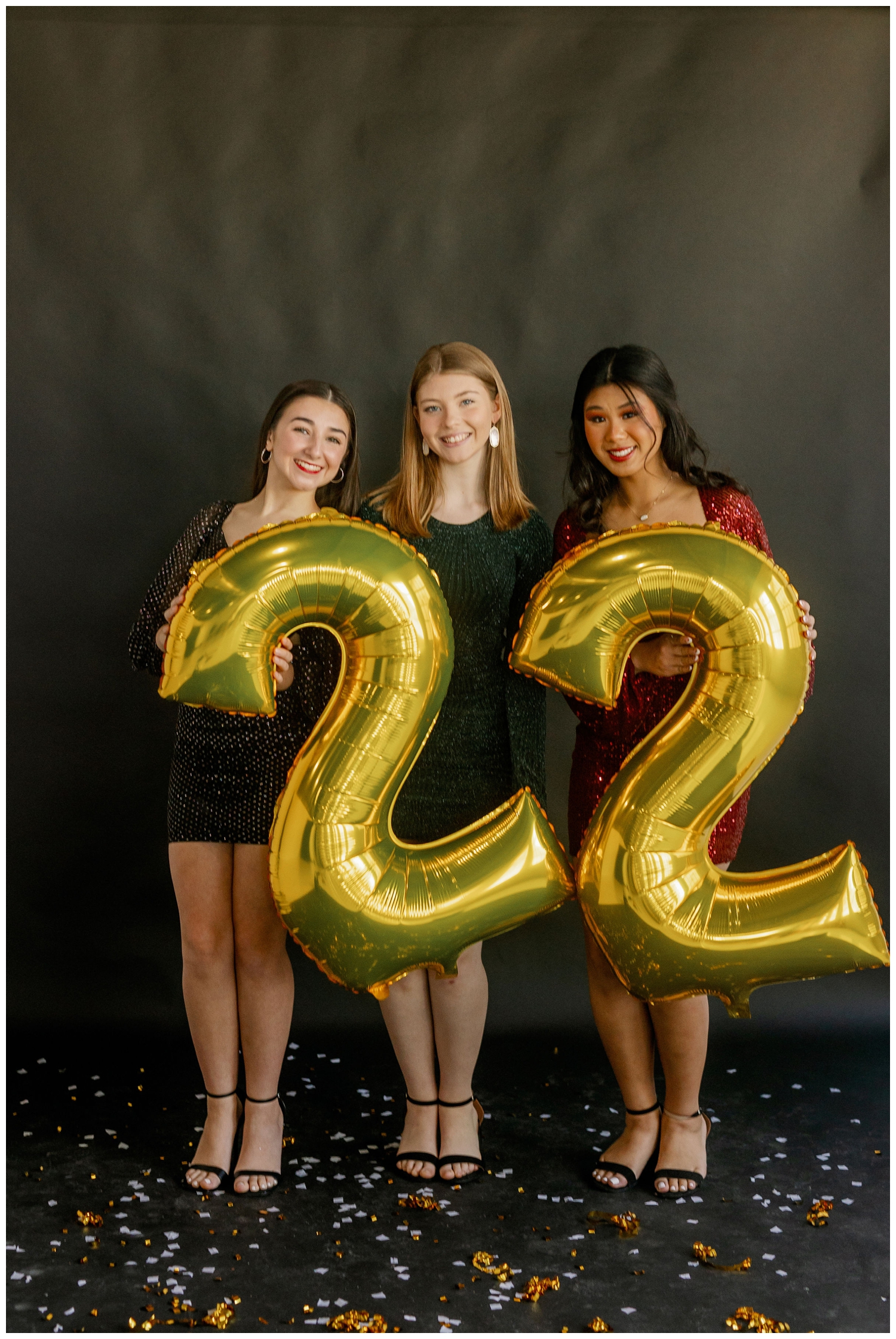three high school senior girls holding a 22 balloon for Houston Senior Model Team shoot