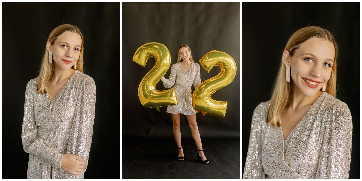 high school senior girl in champagne dress holding number two balloons for New Years senior pictures