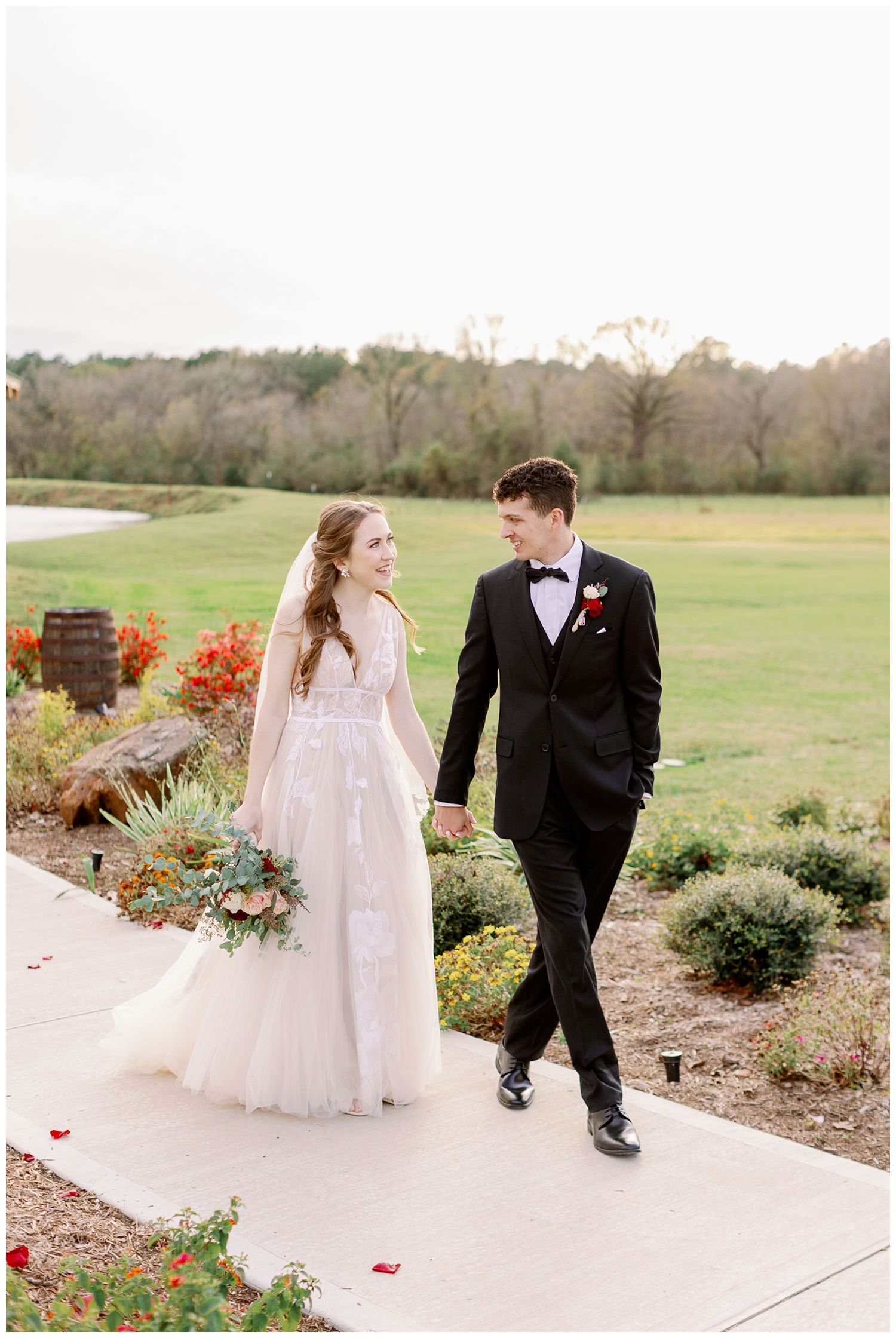 Union Ranch wedding with bride and groom holding hands walking