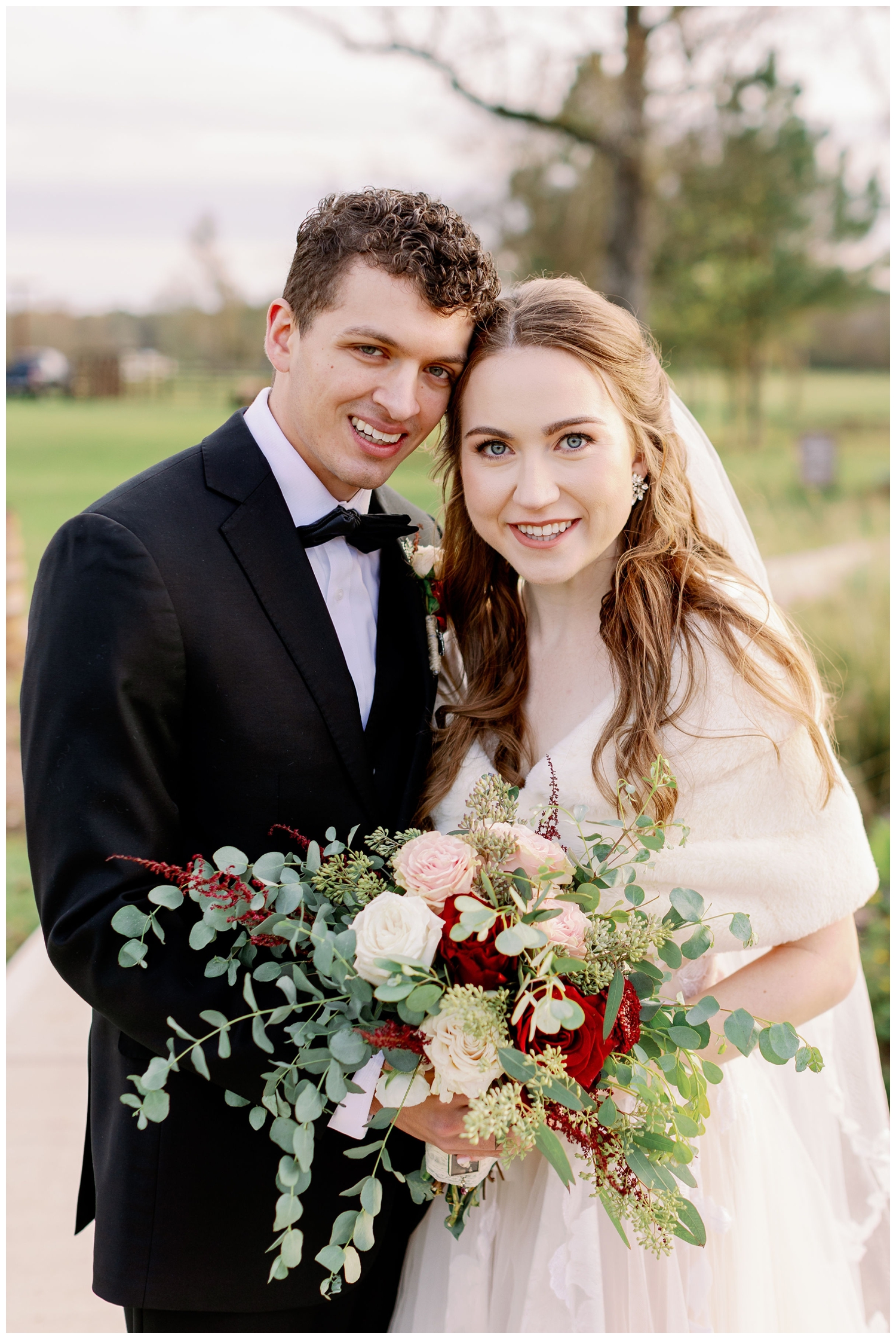 bride and groom smiling at camera for winter Union Ranch wedding