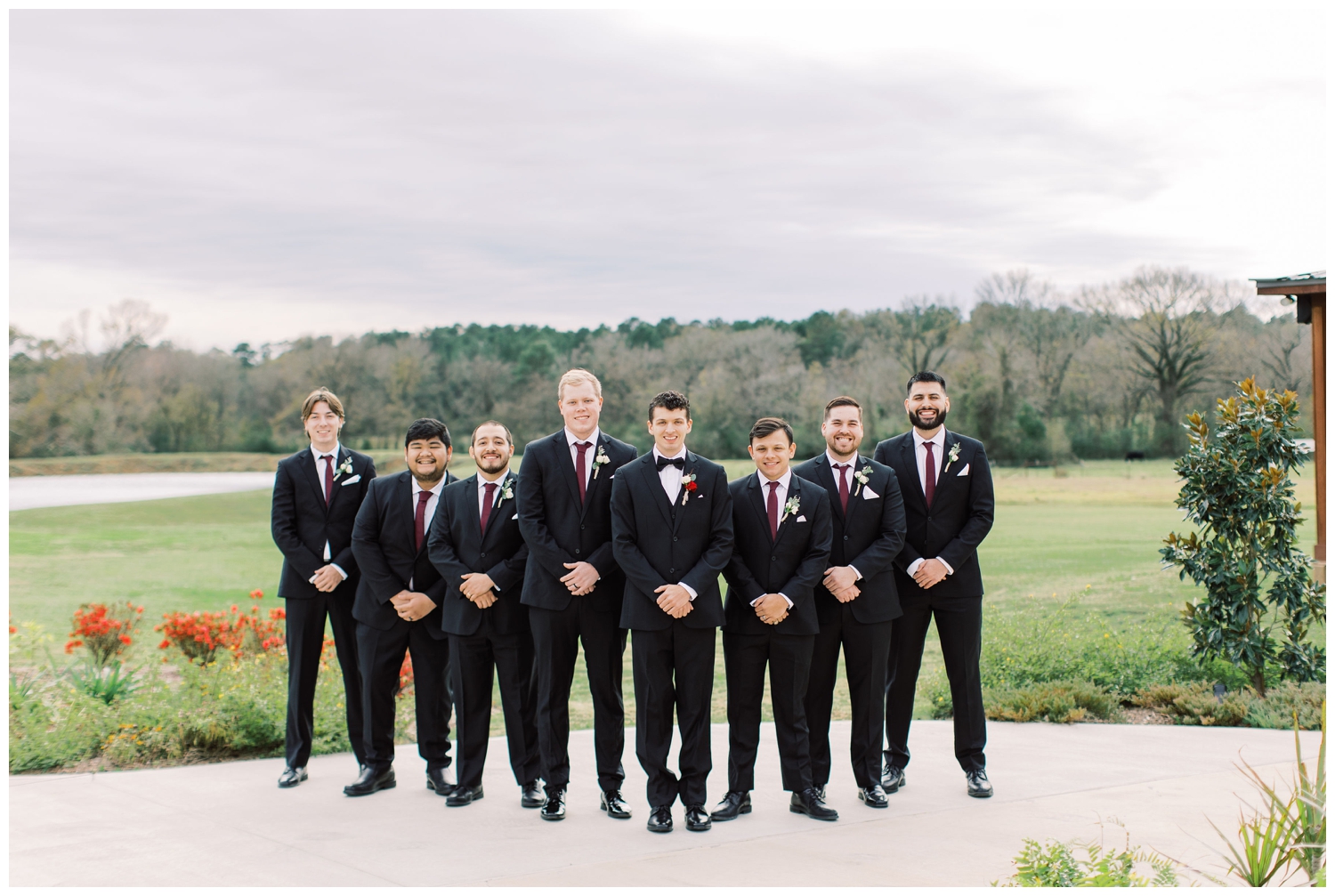 groom and groomsmen standing outside Union Ranch wedding venue