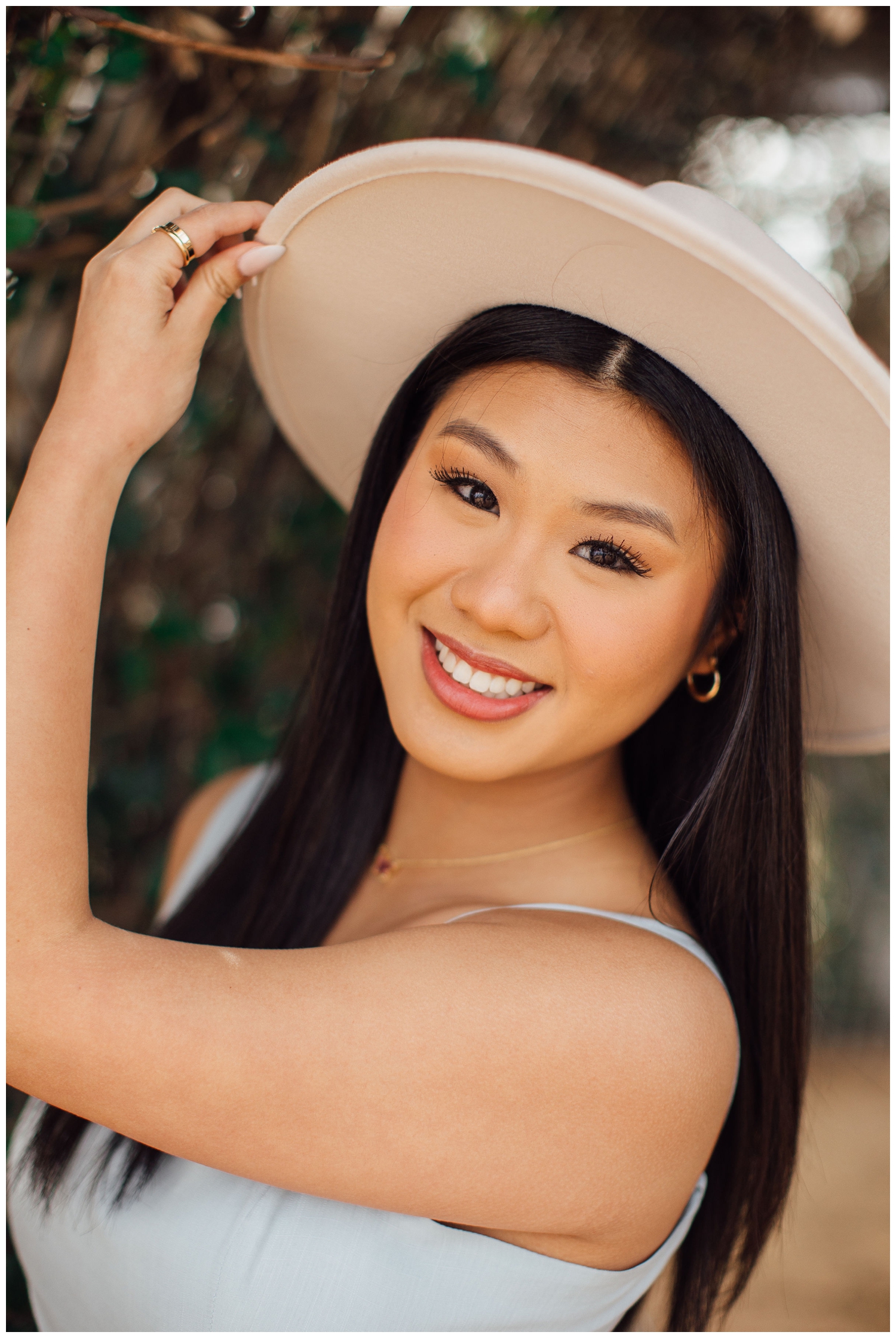 closeup portrait of senior girl in hat by Reed Gallagher Photography