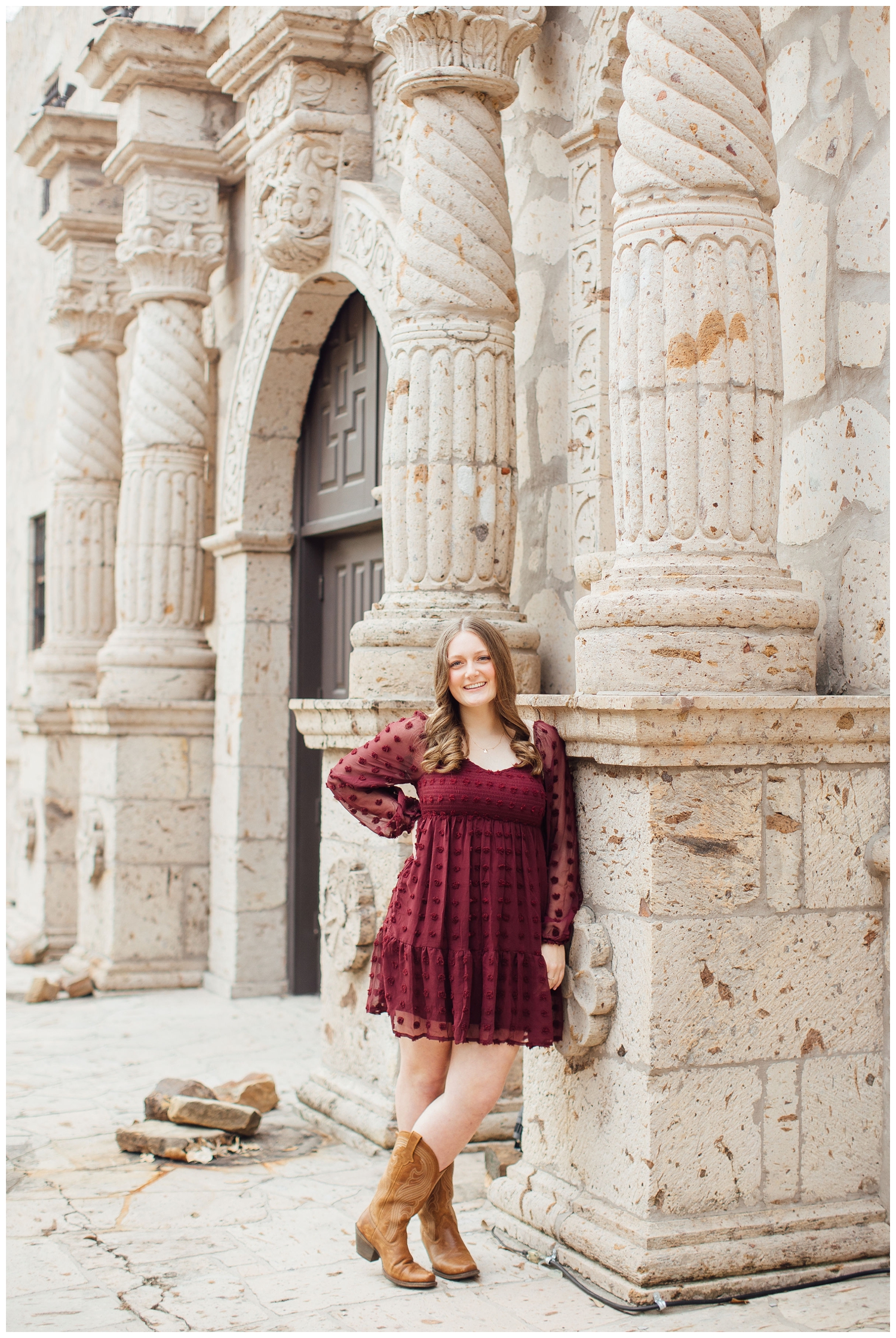 high school senior standing and leaning against Alamo building Cypress senior photographer at Cy-Hope