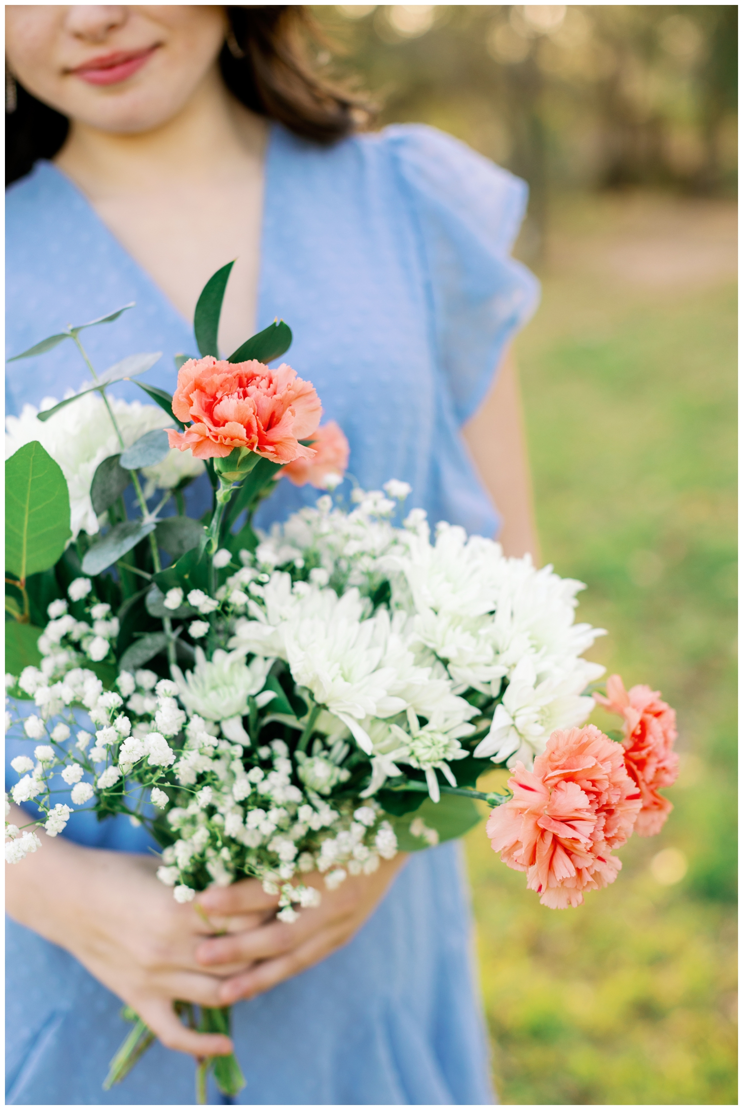 detailed shot of orange and white floral bouquet