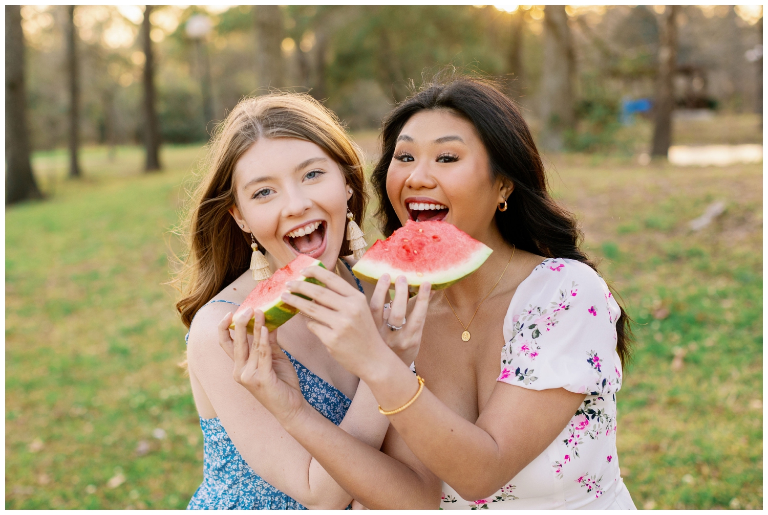 two Houston seniors eating slices of watermelon for senior picnic outdoors at Cy-Hope