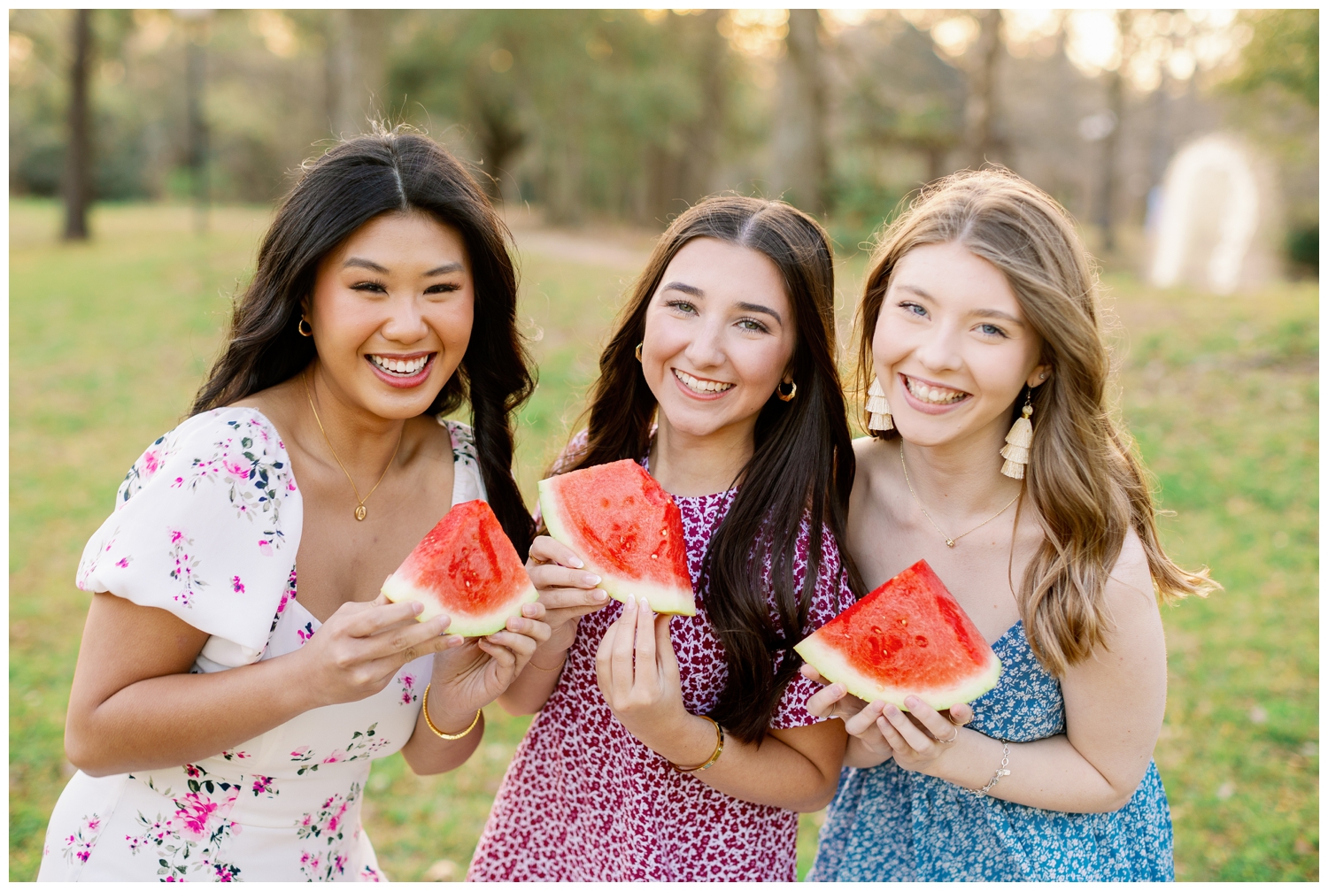 Houston high school senior girls eating watermelon at outdoor picnic