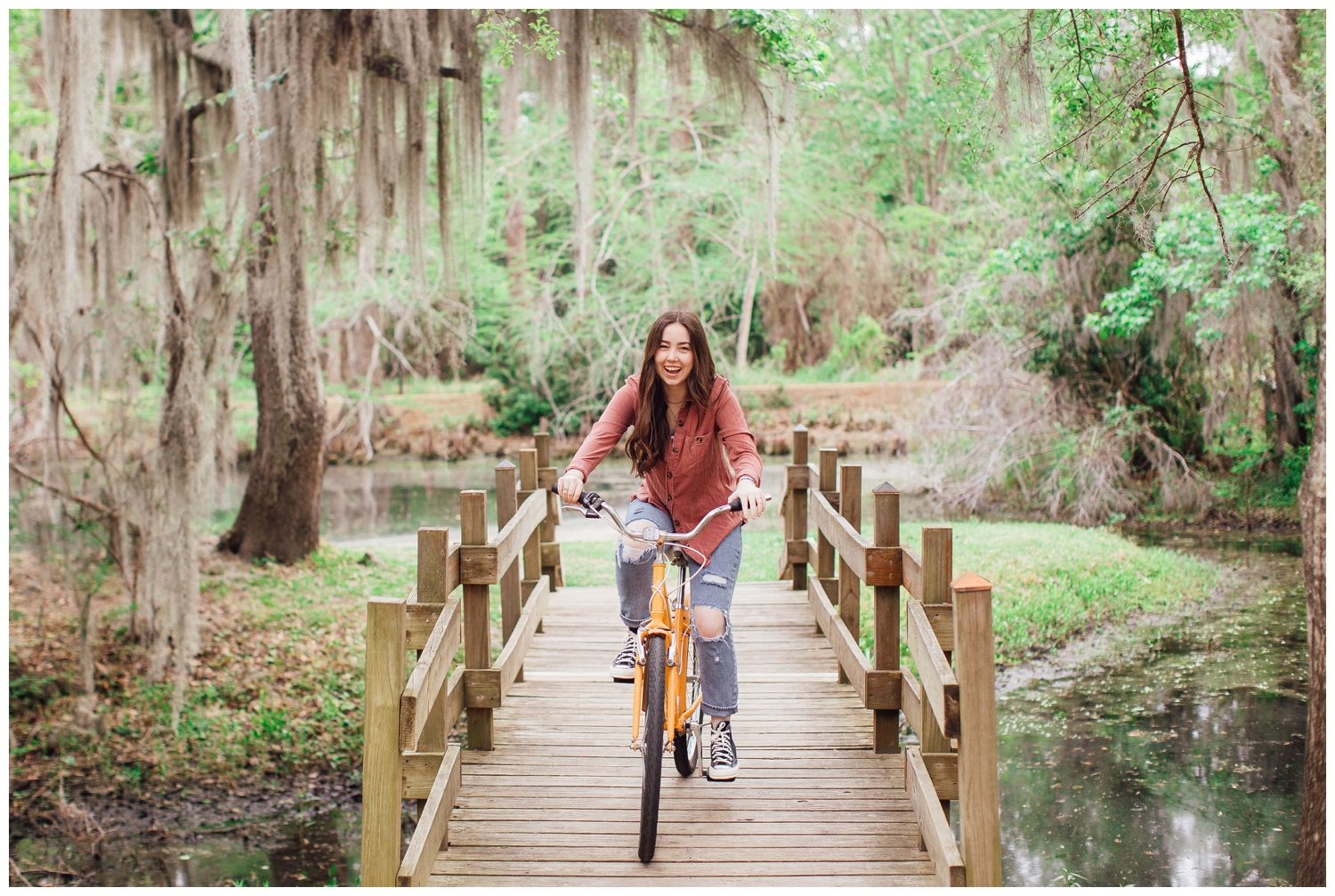 Houston senior girl at Cy-Hope riding bike on the bridge