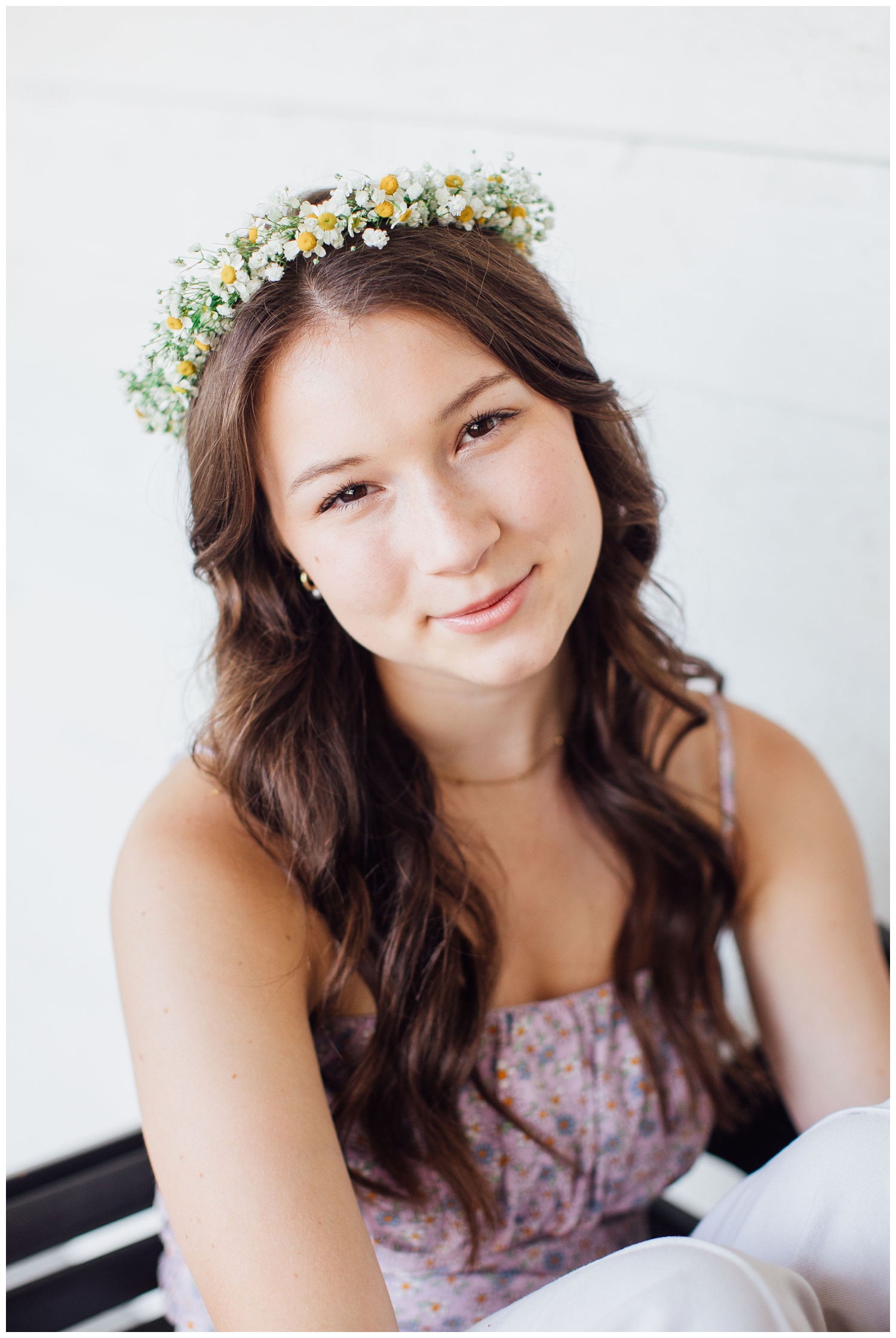 girl looking at camera wearing flower crown
