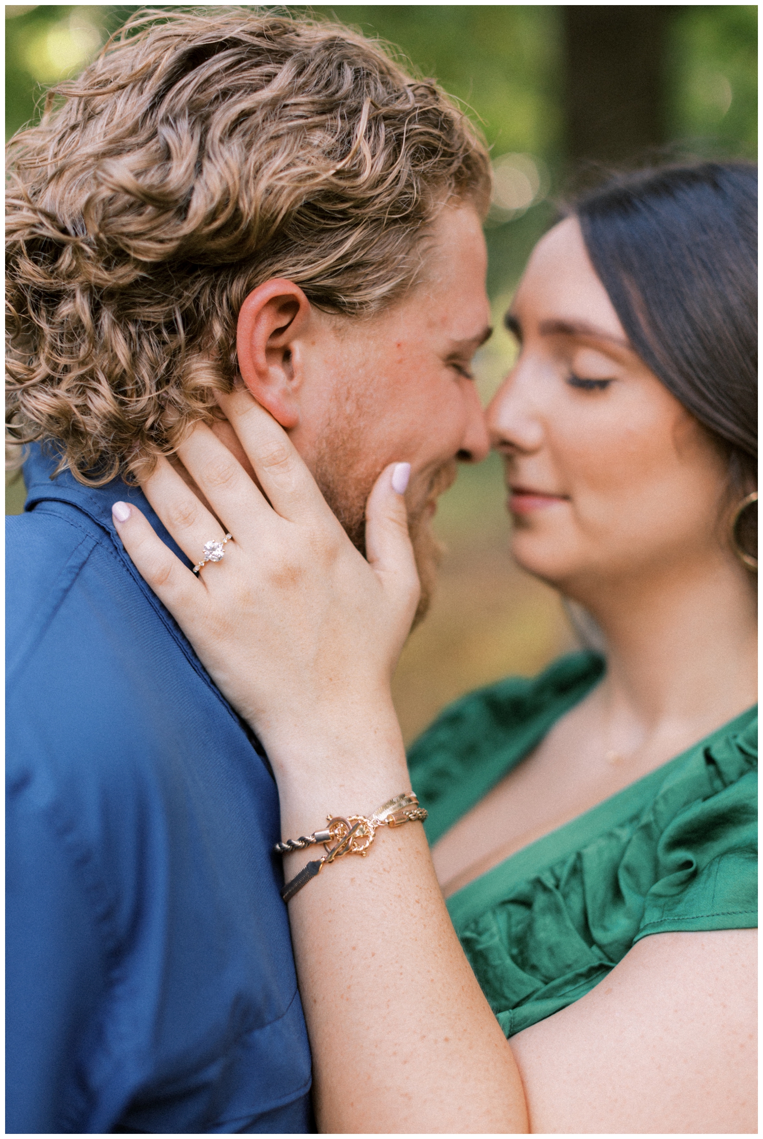 coupled nuzzled nose to nose at outdoor state park engagement photos Huntsville, Texas