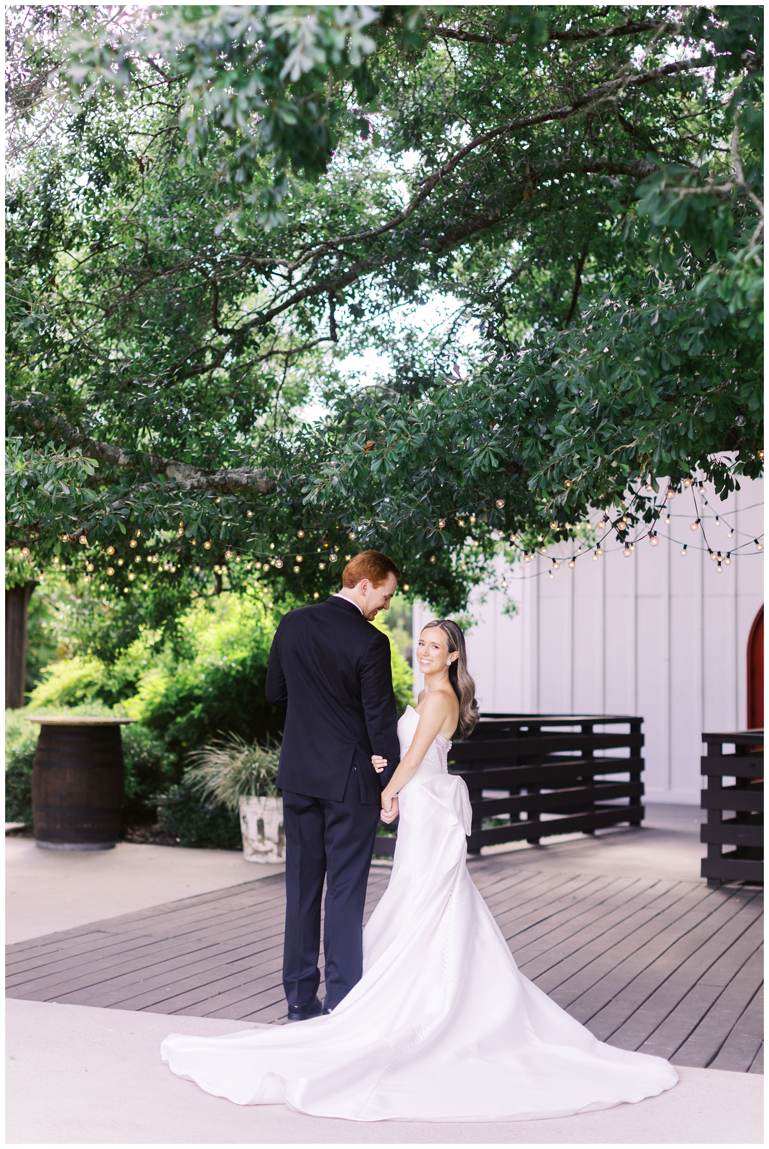 bride and groom holding hands at The Carriage House Houston venue