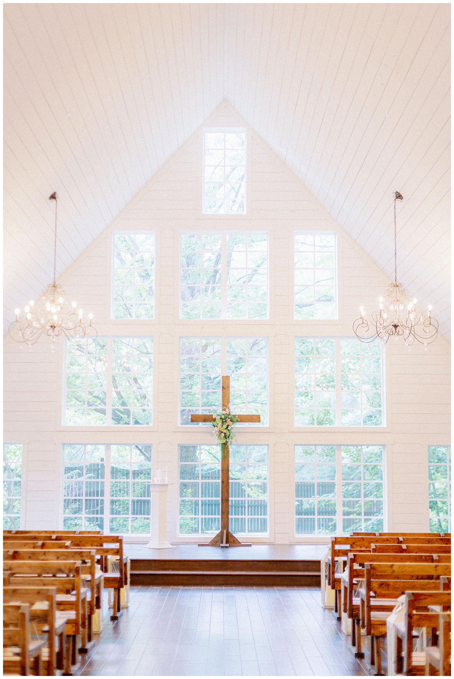 wooden cross standing inside the chapel at The Carriage House Houston wedding venue