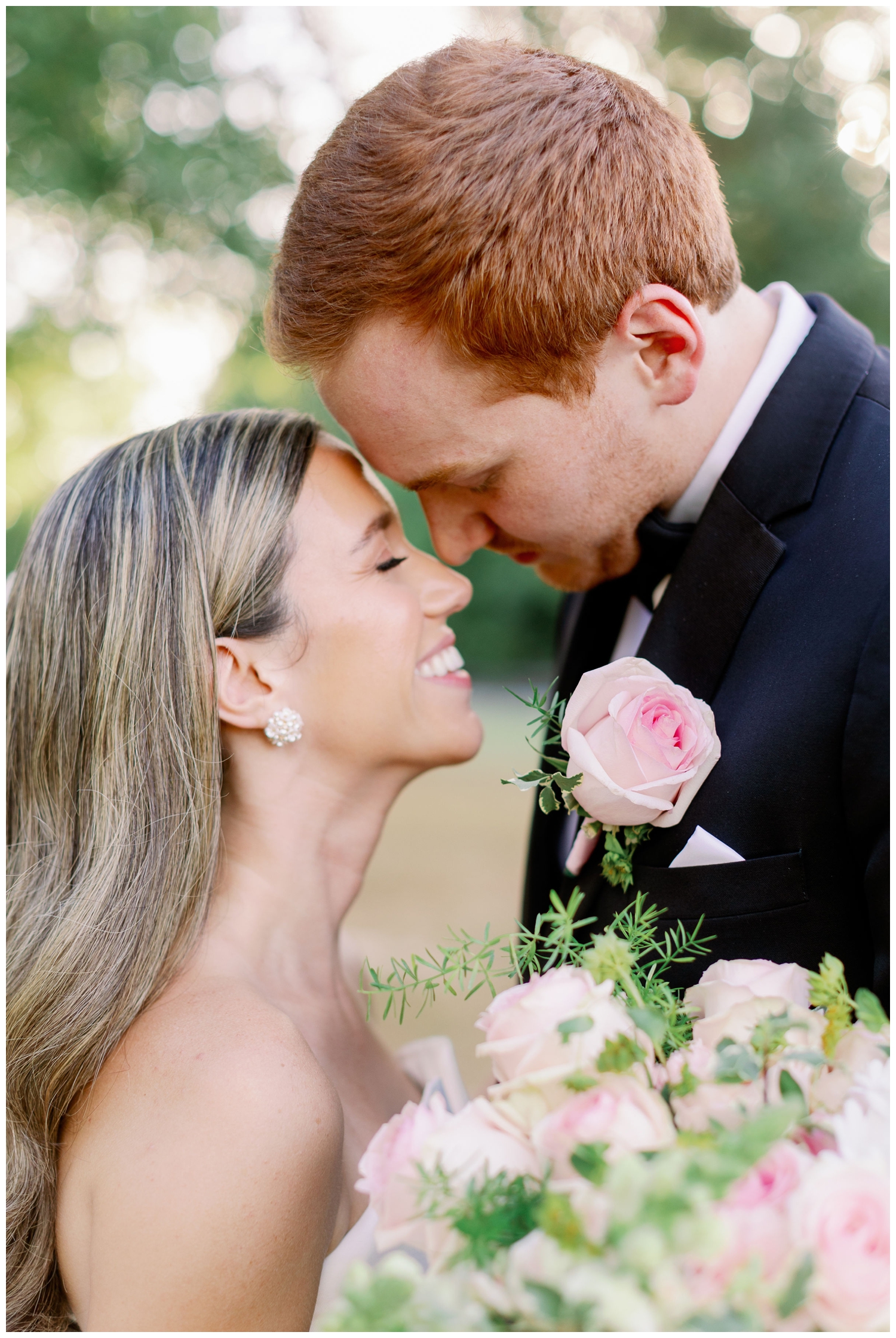 nose to nose pose bride and groom portrait outdoors