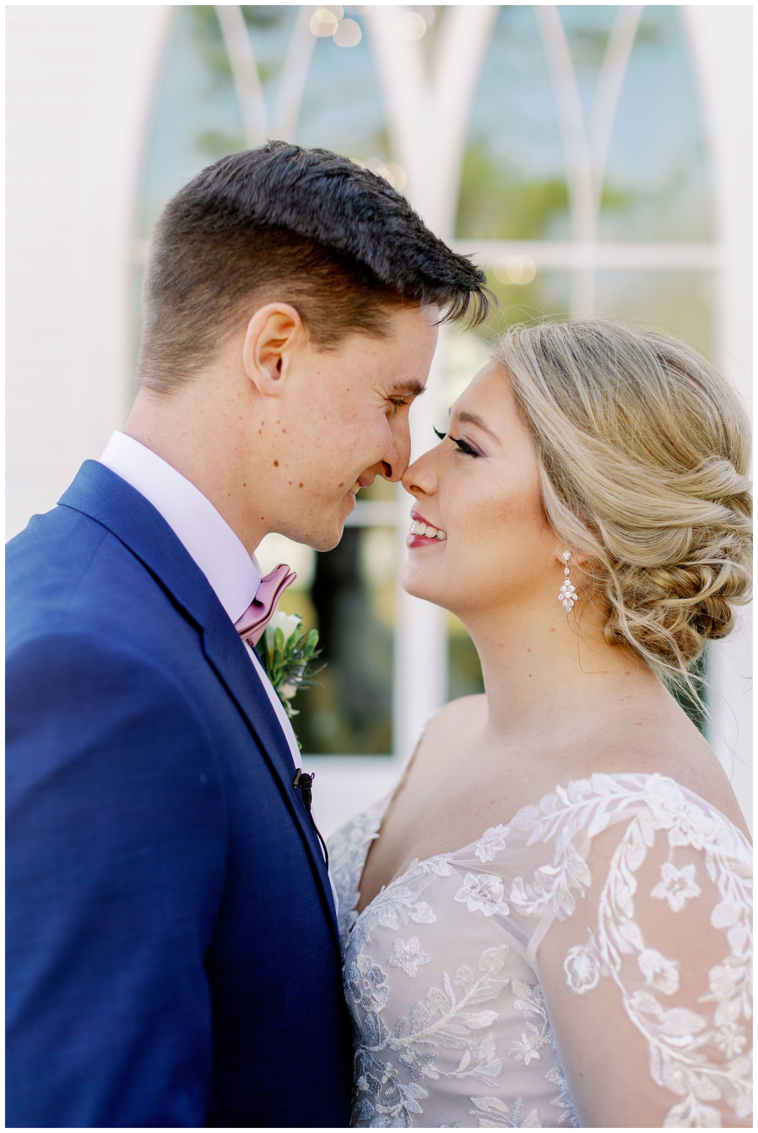 bride and groom nose to nose portrait standing outside the The Springs Wallisville Wedding venue