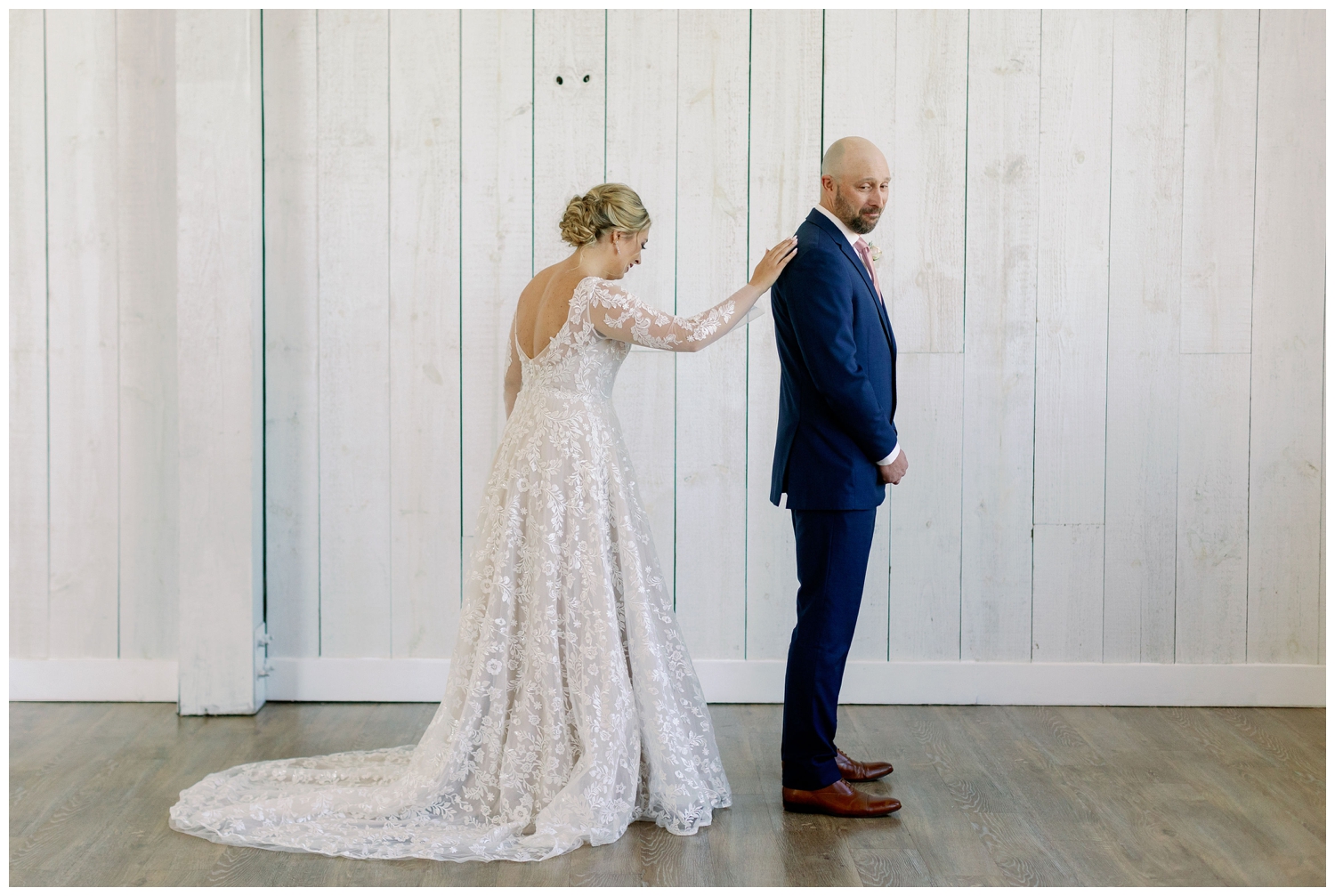 father daughter first look with bride touching Dad's shoulder