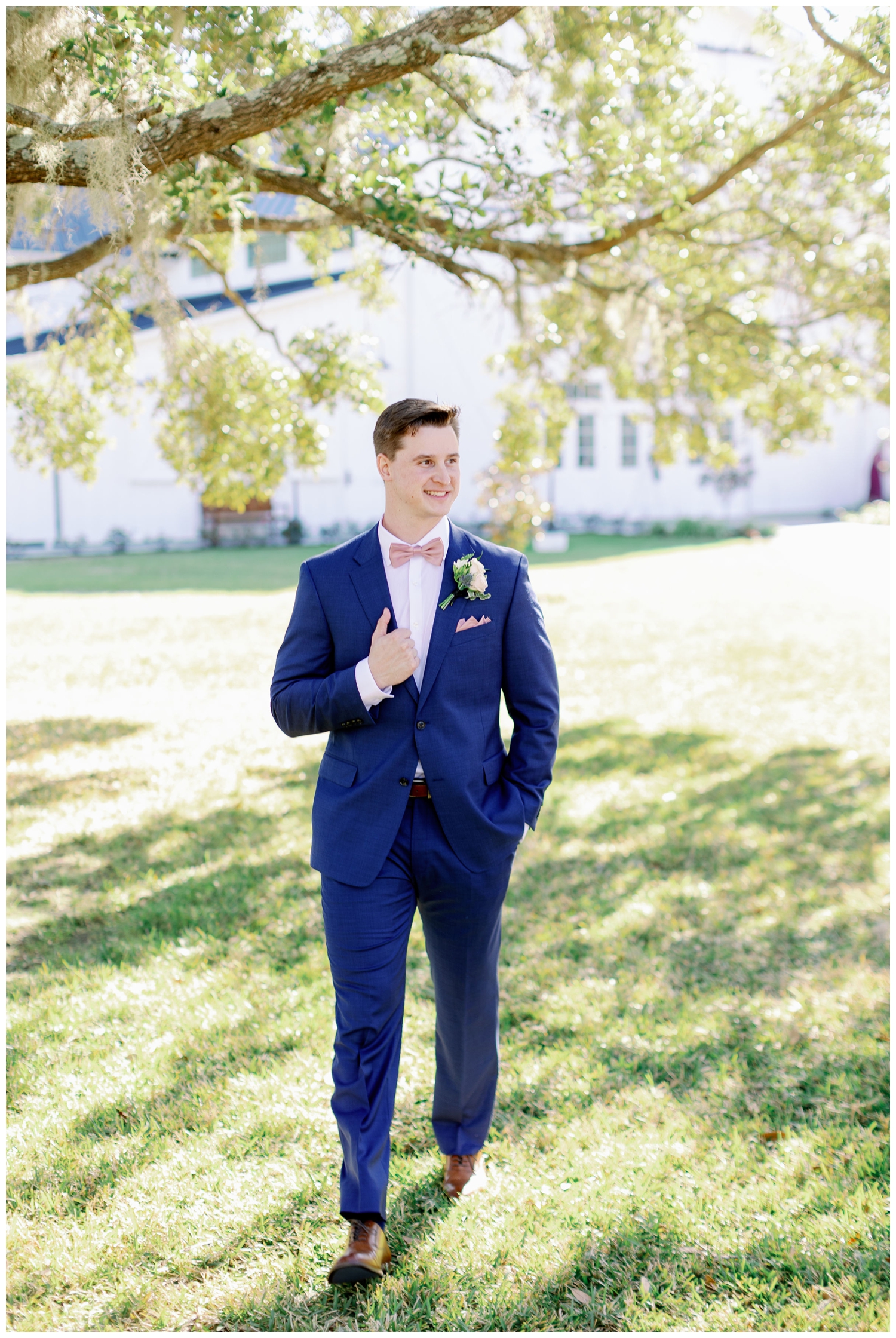 groom with hand on jacket at The Springs Wallisville Wedding for outdoor portrait