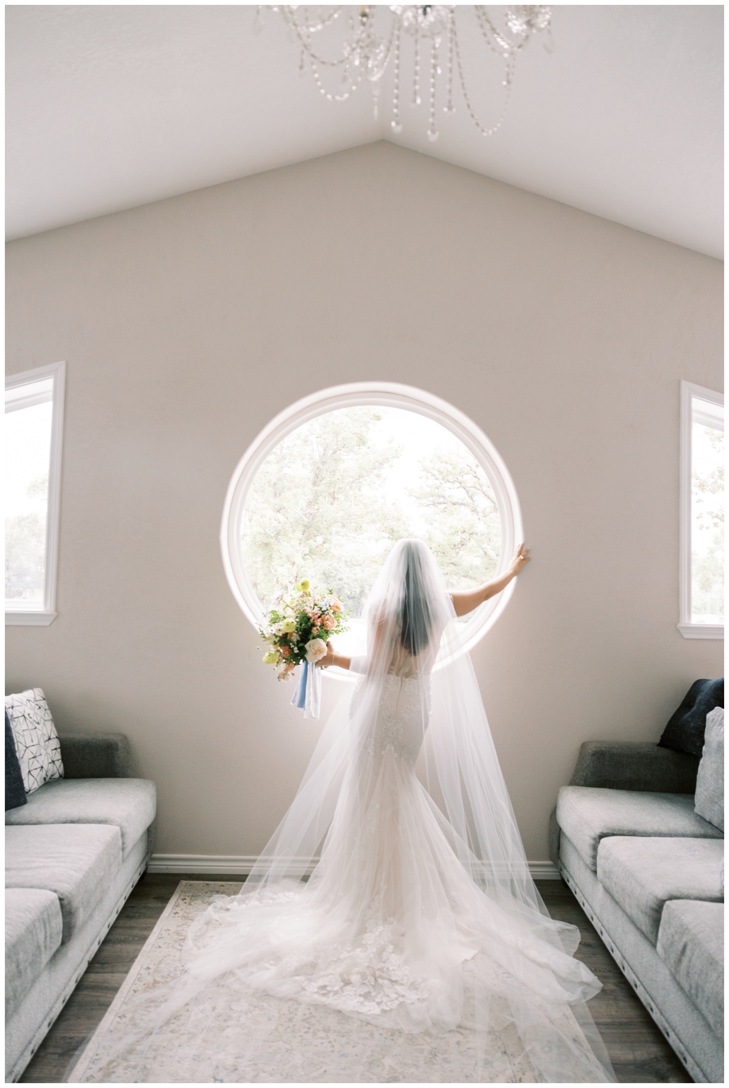 bridal portrait in bridal suite at Bluebird Haven Estates Wedding venue with bride looking out window