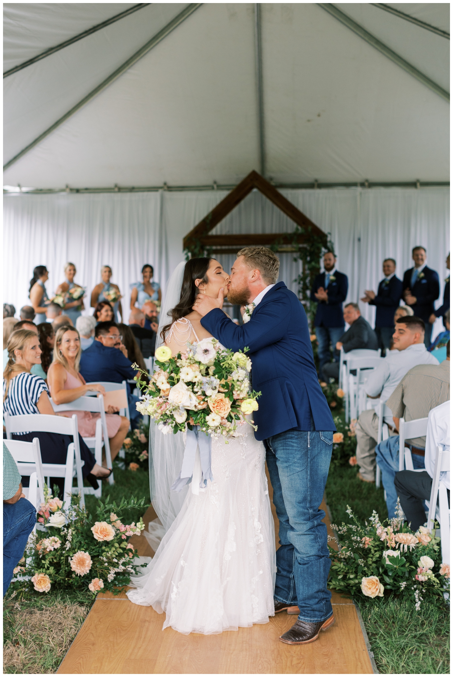 bride and groom kissing Bluebird Haven Estates Wedding outdoor ceremony