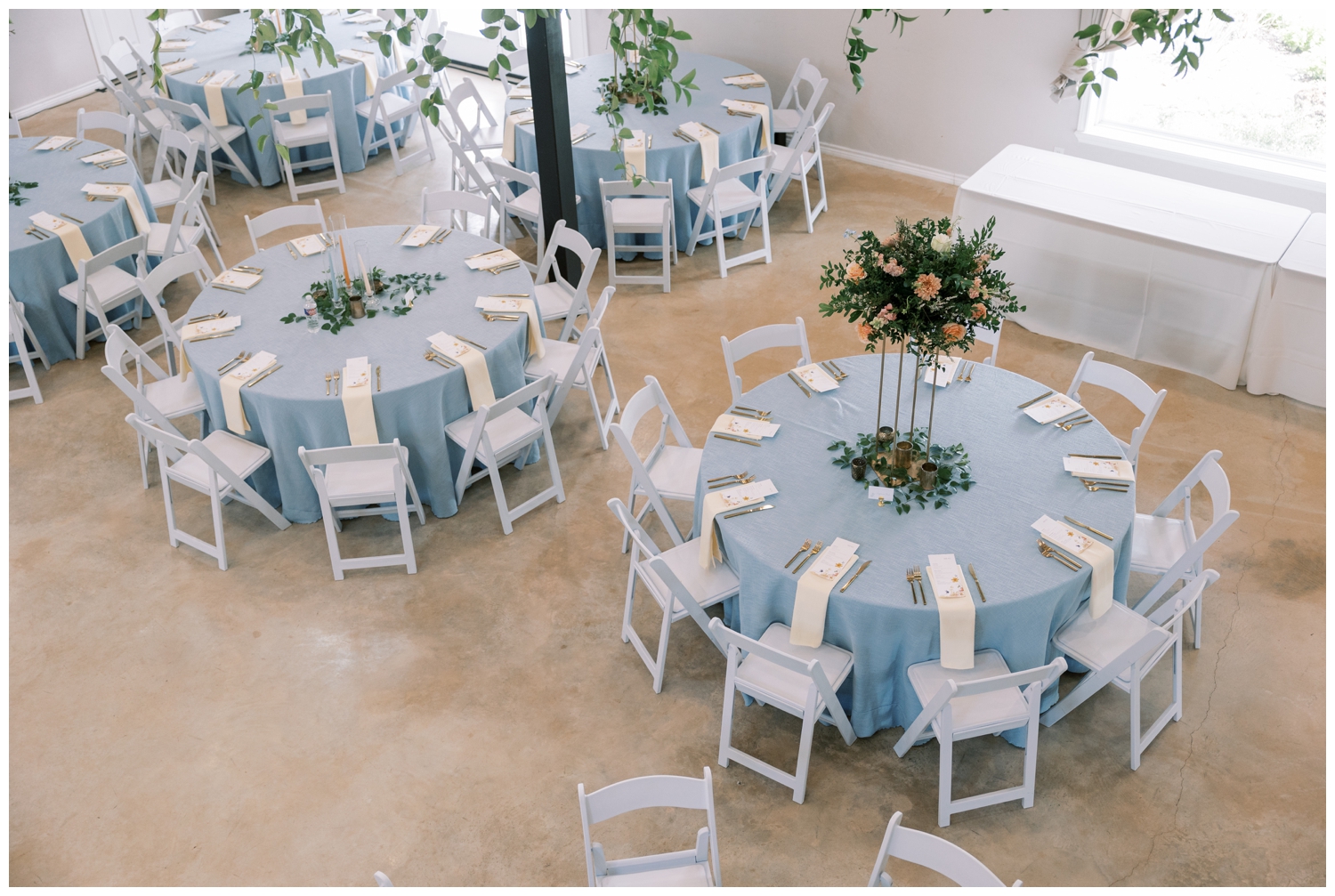 Bluebird Haven Estates Wedding reception with blue table linens and white chairs