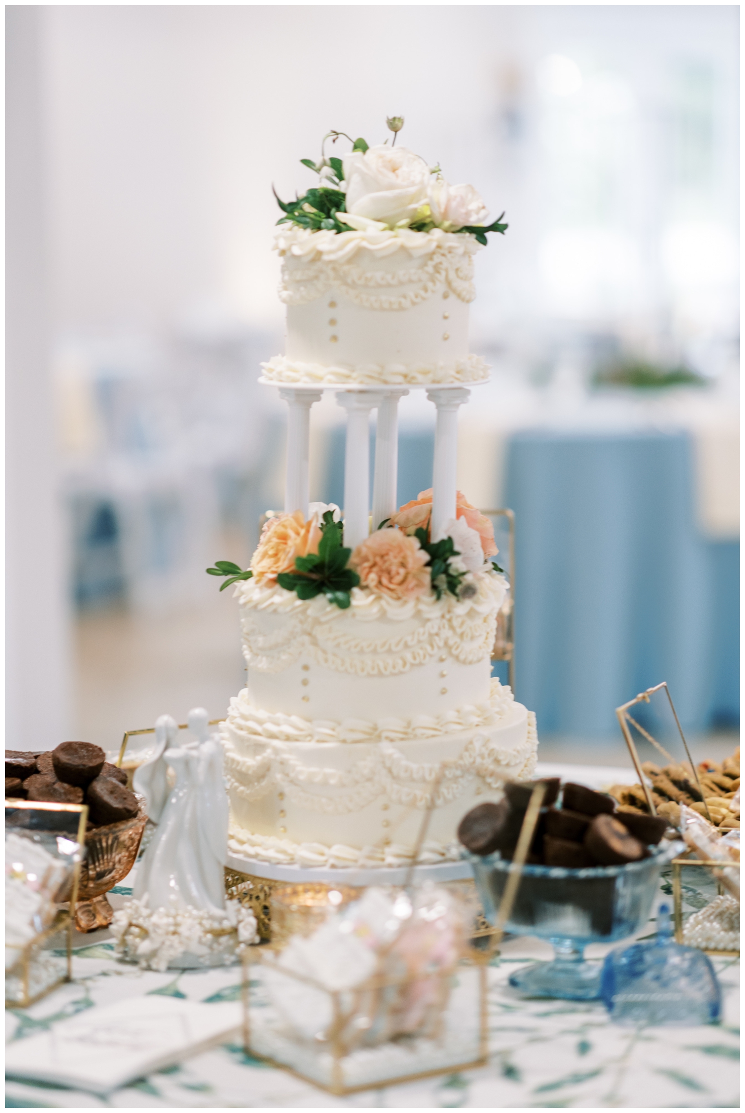 white wedding cake with peach florals