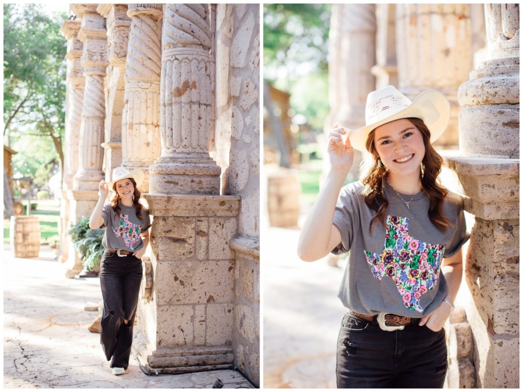 girl in black jeans and t-shirt tipping cowboy hat outdoors at Cy-Hope for fall senior photos Houston