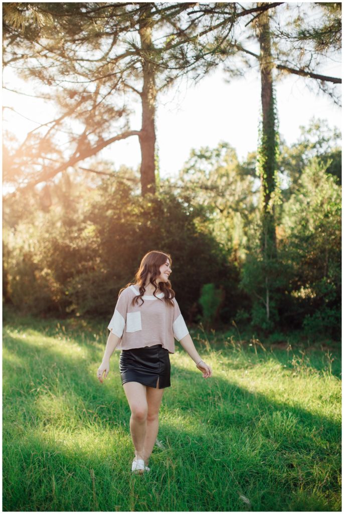 girl skipping in a field outside at Cy-Hope for Reed Gallagher Photography