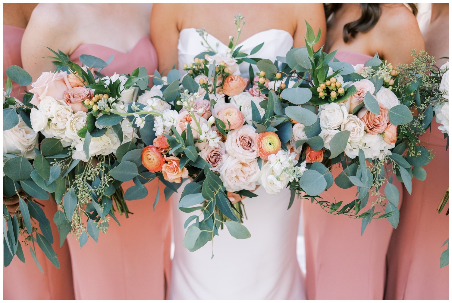 detailed image of peach and coral bridesmaids bouquets