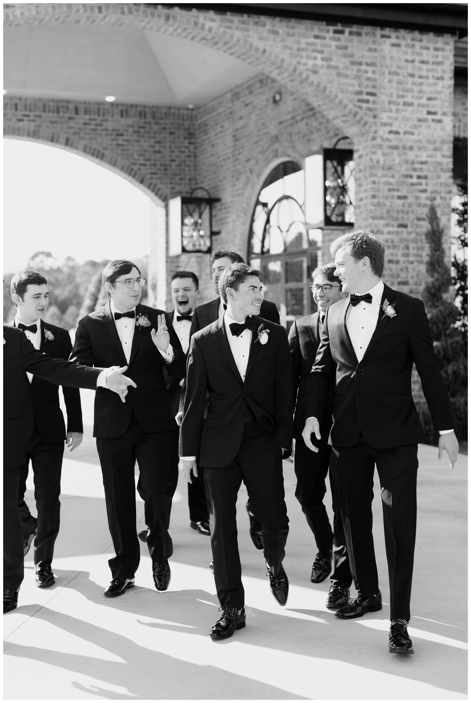 groom and groommens in black tux walking