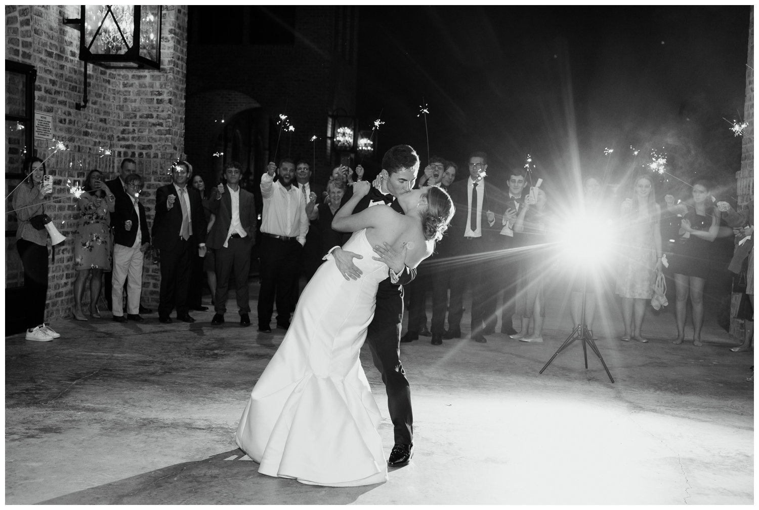 newlywed kiss during sparkler exit elegant Iron Manor Wedding
