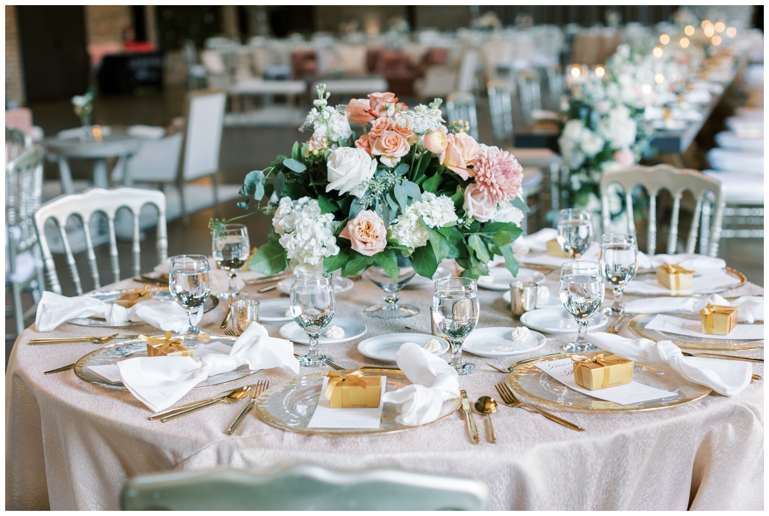 champagne table linens with gold place setting inside elegant Iron Manor Wedding