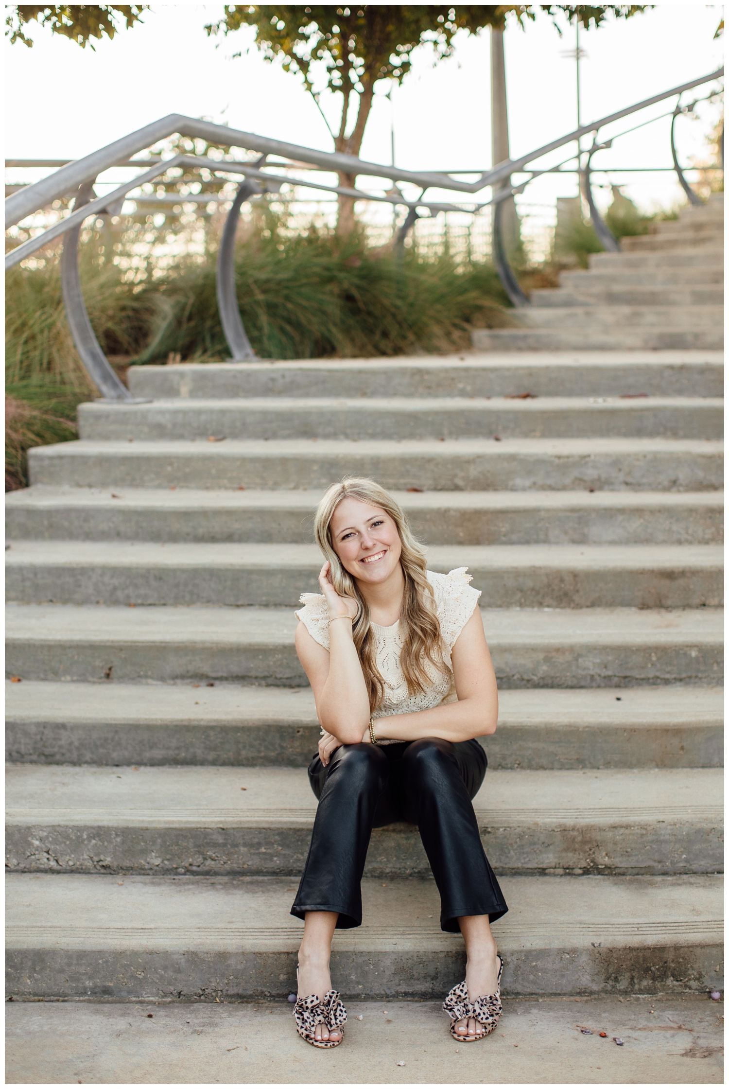 girl sitting on staircase for Outdoor Houston senior photography Sabine Street